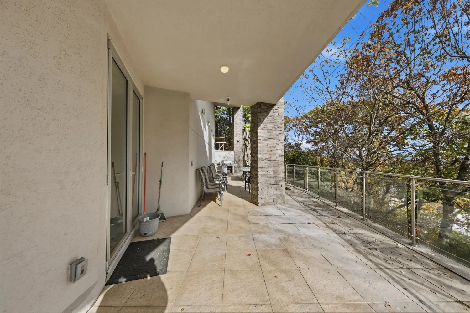 a view of balcony with wooden floor and fence