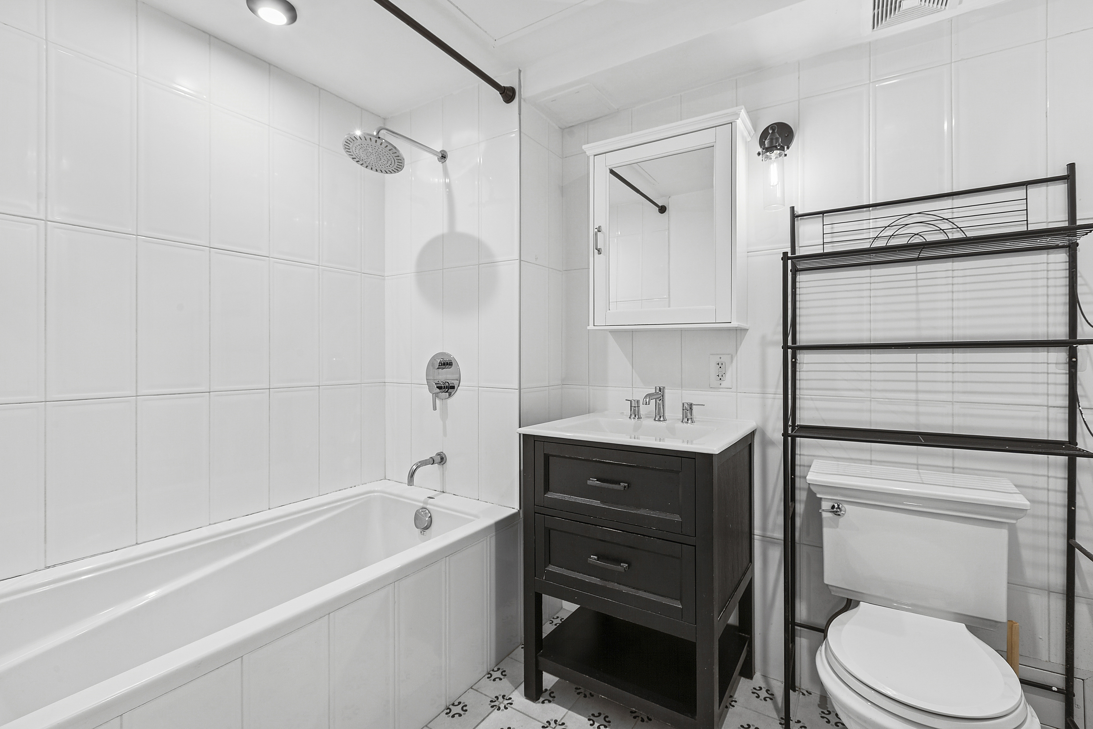 1255 Bushwick Avenue, Unit 3D Brooklyn, NY 11207 - Photo 6 of 6 a bathroom with a sink toilet and shower