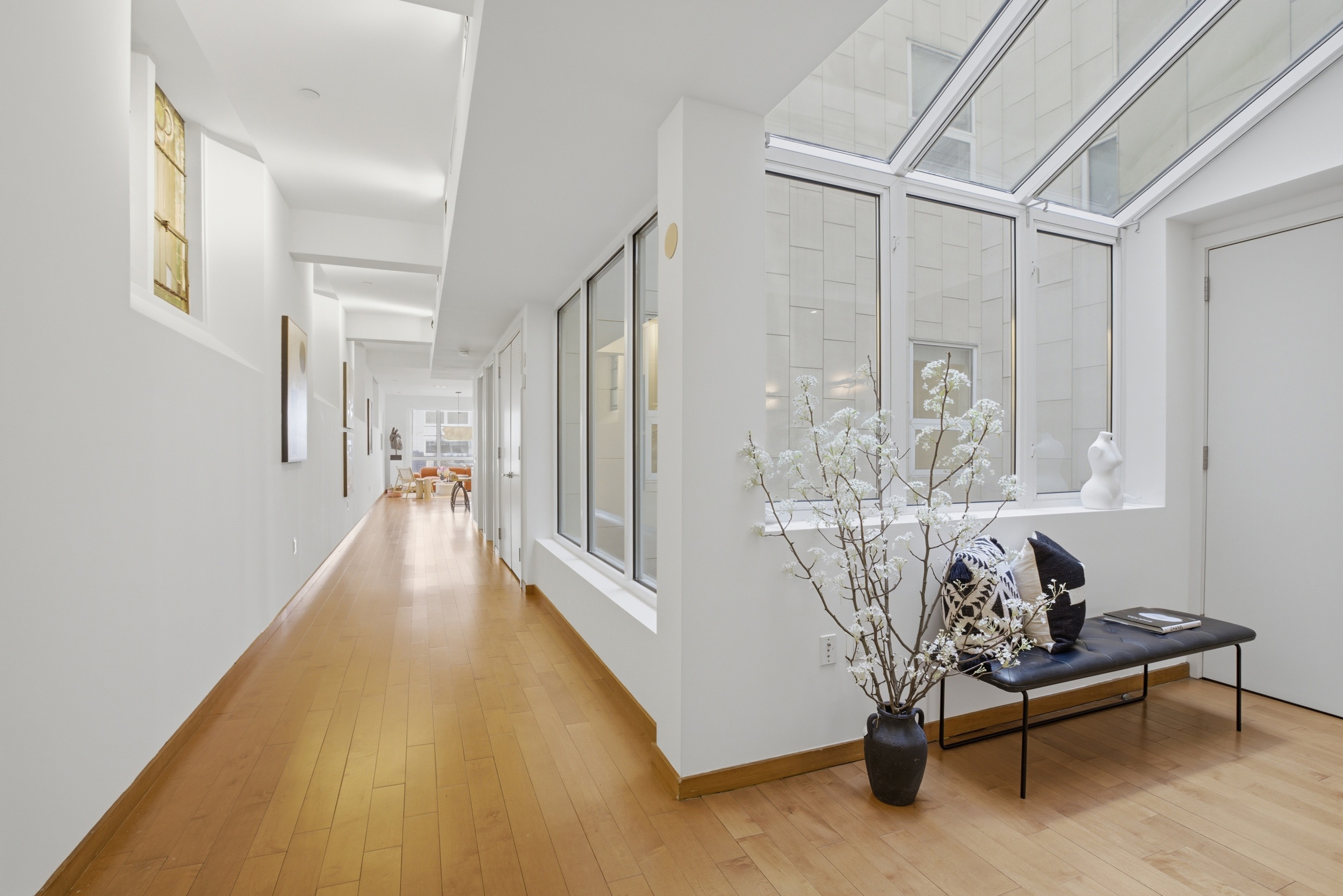 135 West 4th Street, Unit 2W Manhattan, NY 10012 - Photo 5 of 20 a view of a livingroom with furniture and a window