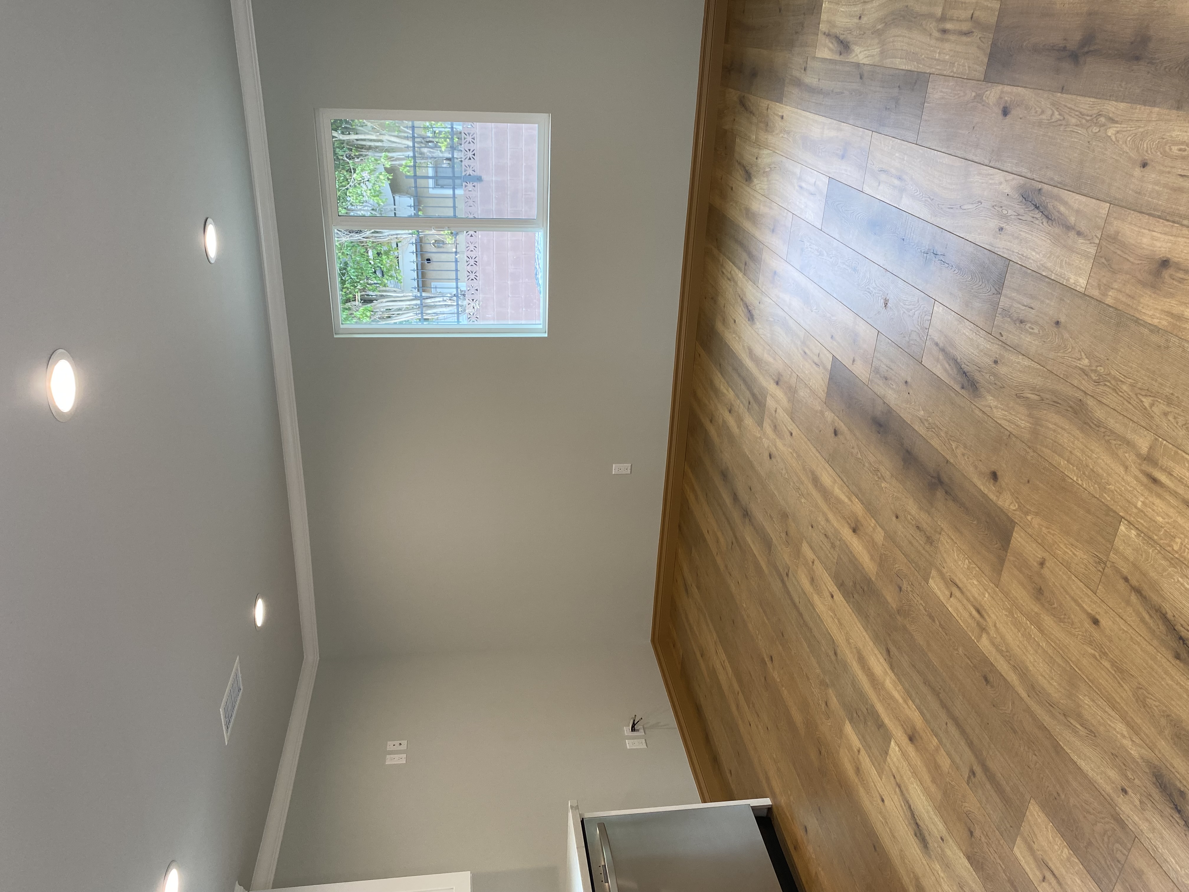 5151 Nagle Avenue, Unit GUEST Sherman Oaks, CA 91423 - Photo 5 of 11 an empty room with wooden floor and windows