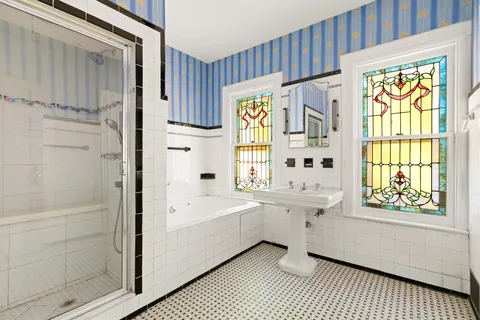 a bathroom with a sink a bathtub and a shower