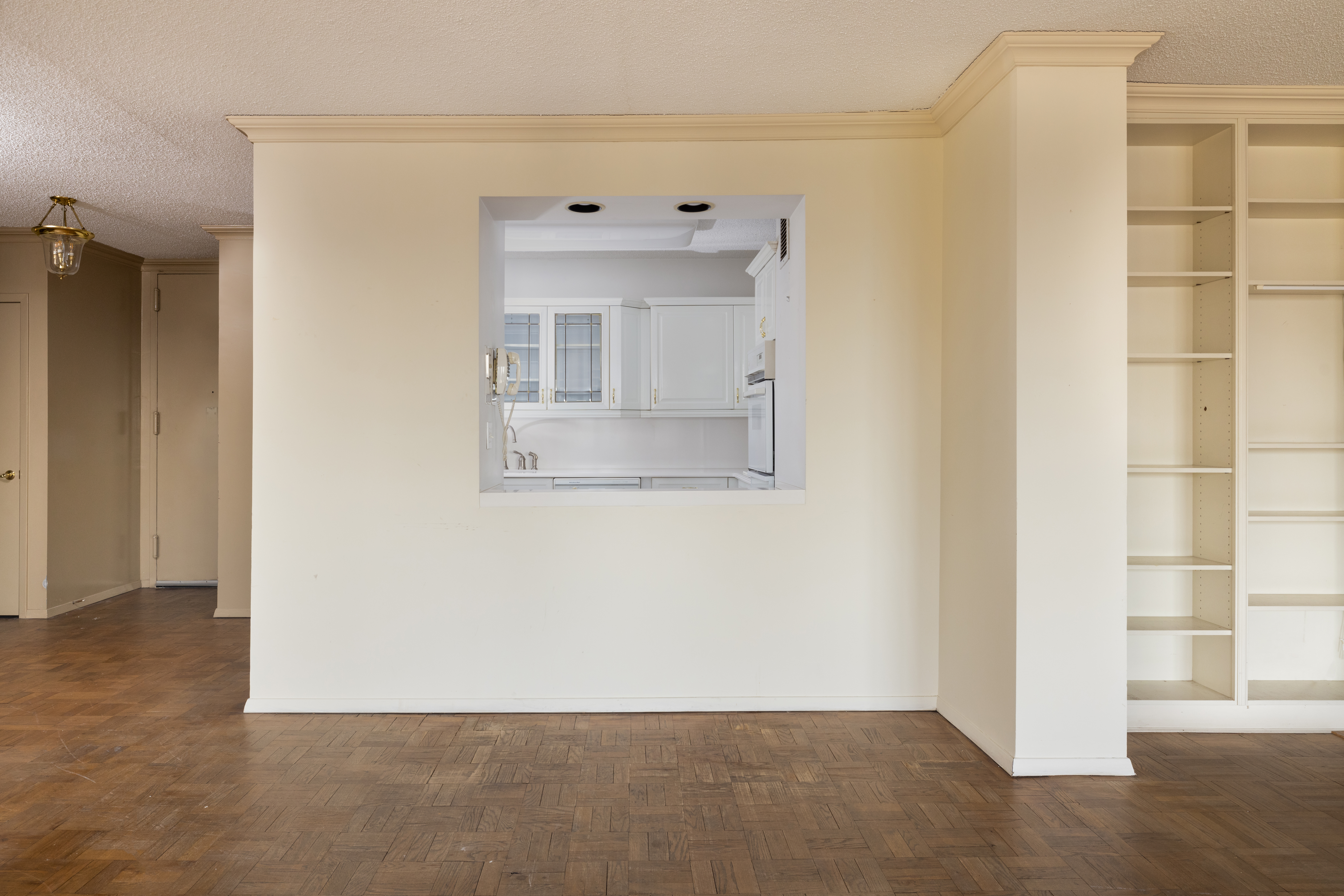 20 West 64th Street, Unit 41H Manhattan, NY 10023 - Photo 9 of 39 an empty room with a window and cabinet