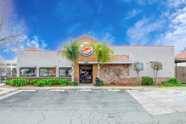 a view of a street with a building in the background