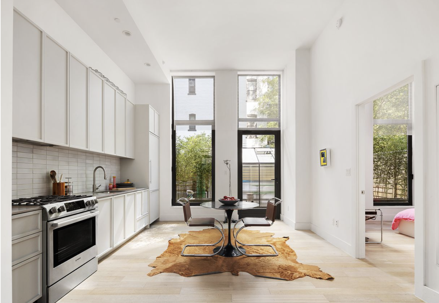 111 Montgomery Street, Unit GARDEN 1B Brooklyn, NY 11225 - Photo 3 of 15 a living room with furniture a window and gym equipment