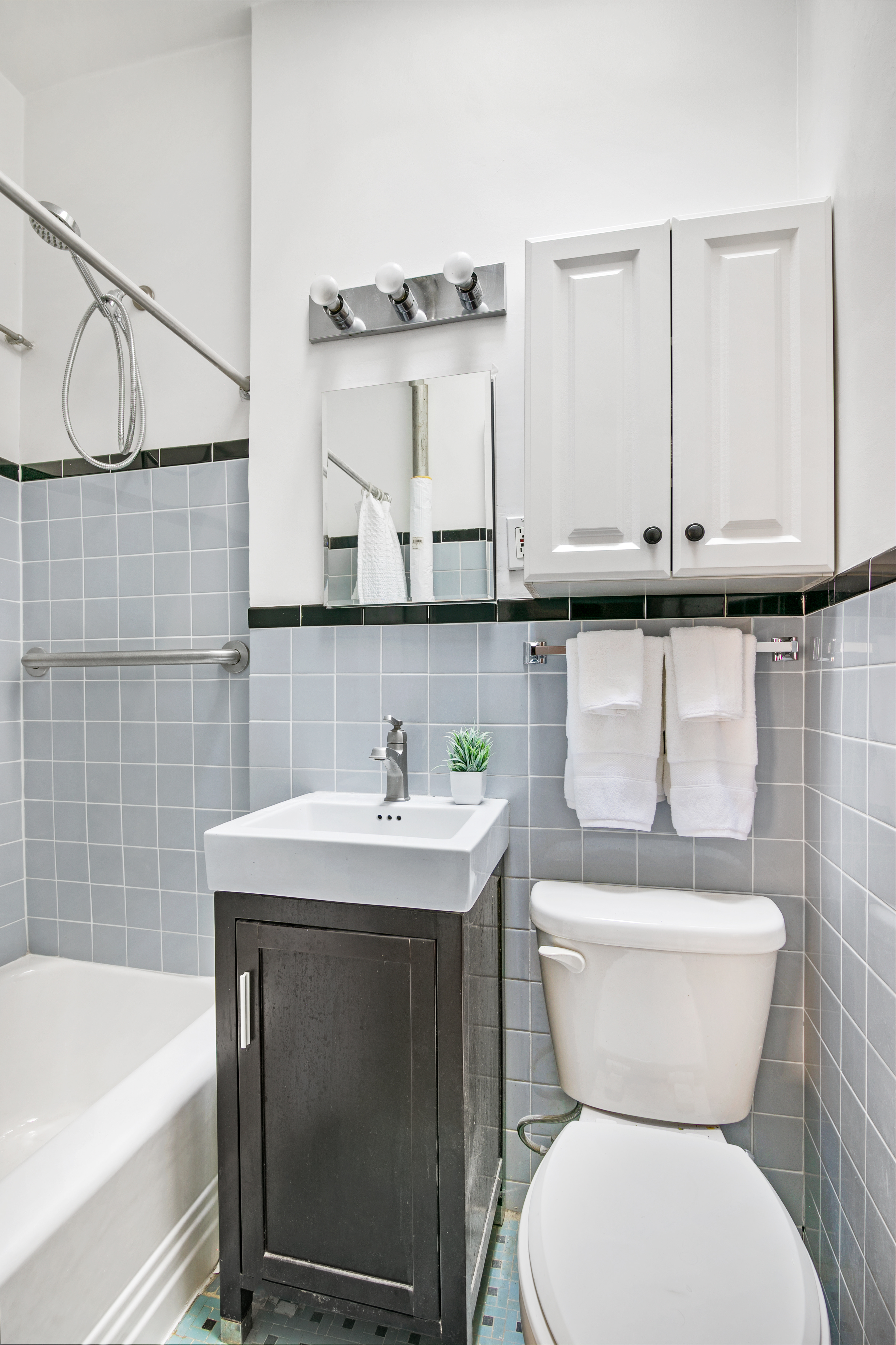 293 Riverside Drive, Unit 5B Manhattan, NY 10025 - Photo 6 of 9 a bathroom with a sink a toilet and bathtub