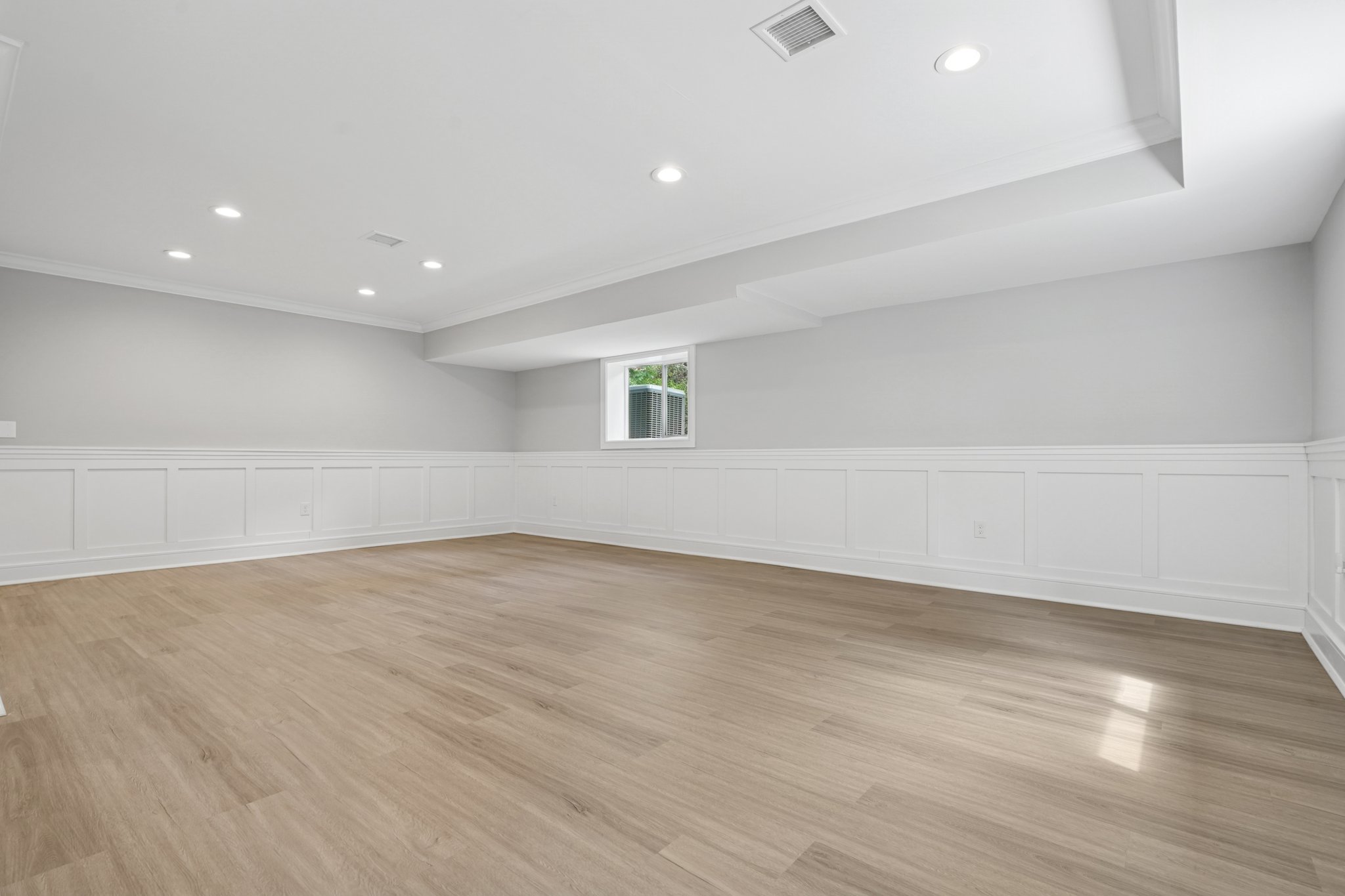 823 River Road Chatham, NJ 07928 - Photo 45 of 60 a view of an empty room with wooden floor and a window