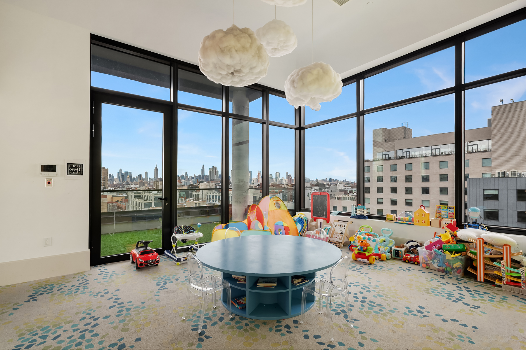 308 North 7th Street, Unit 7E Brooklyn, NY 11211 - Photo 11 of 13 a view of a living room with furniture and floor to ceiling window