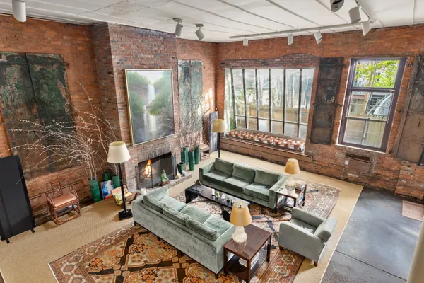 a living room with furniture fireplace and flat screen tv