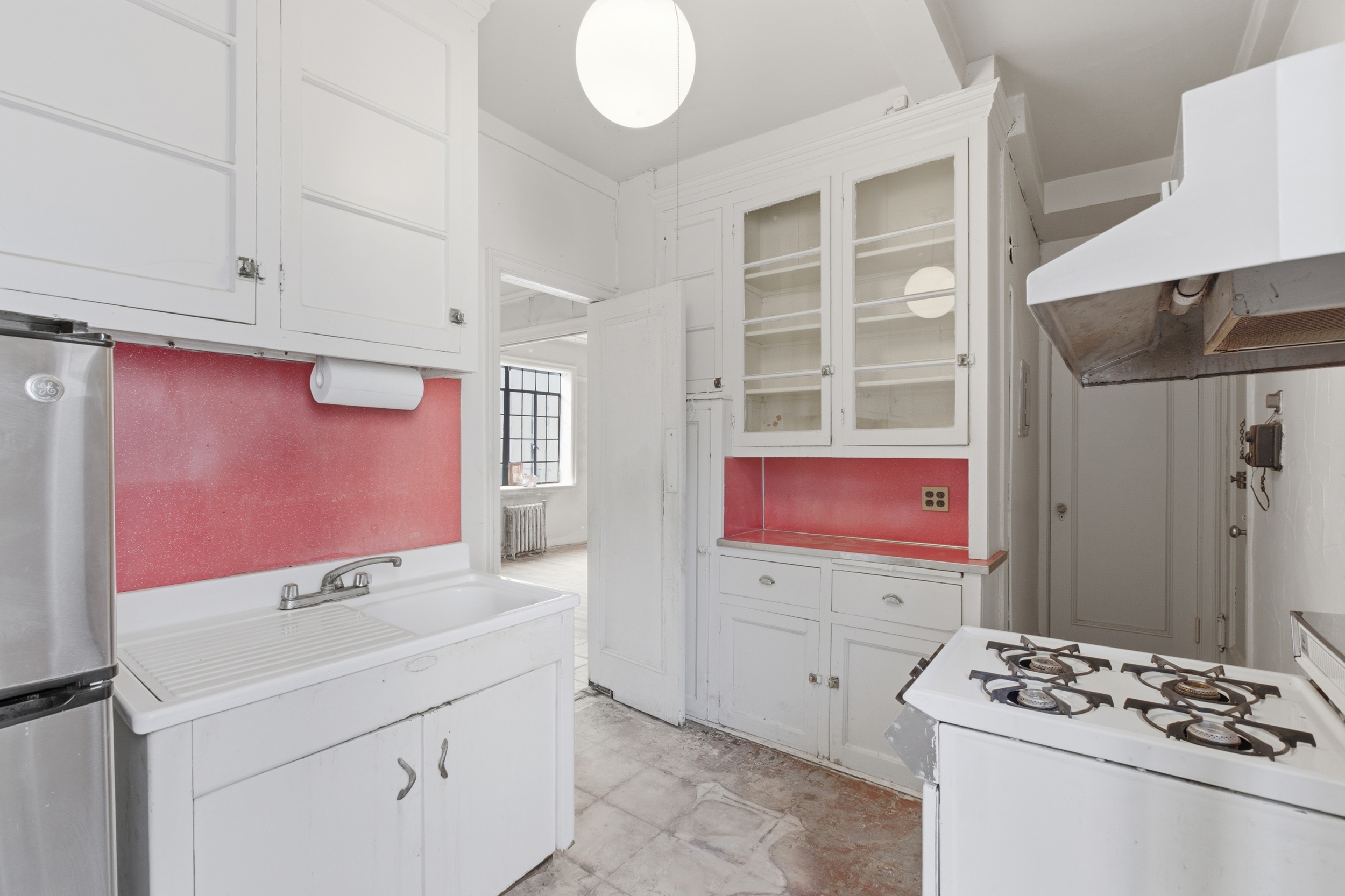 210 West 78th Street, Unit 8C Manhattan, NY 10024 - Photo 6 of 21 a bathroom with a sink and a mirror
