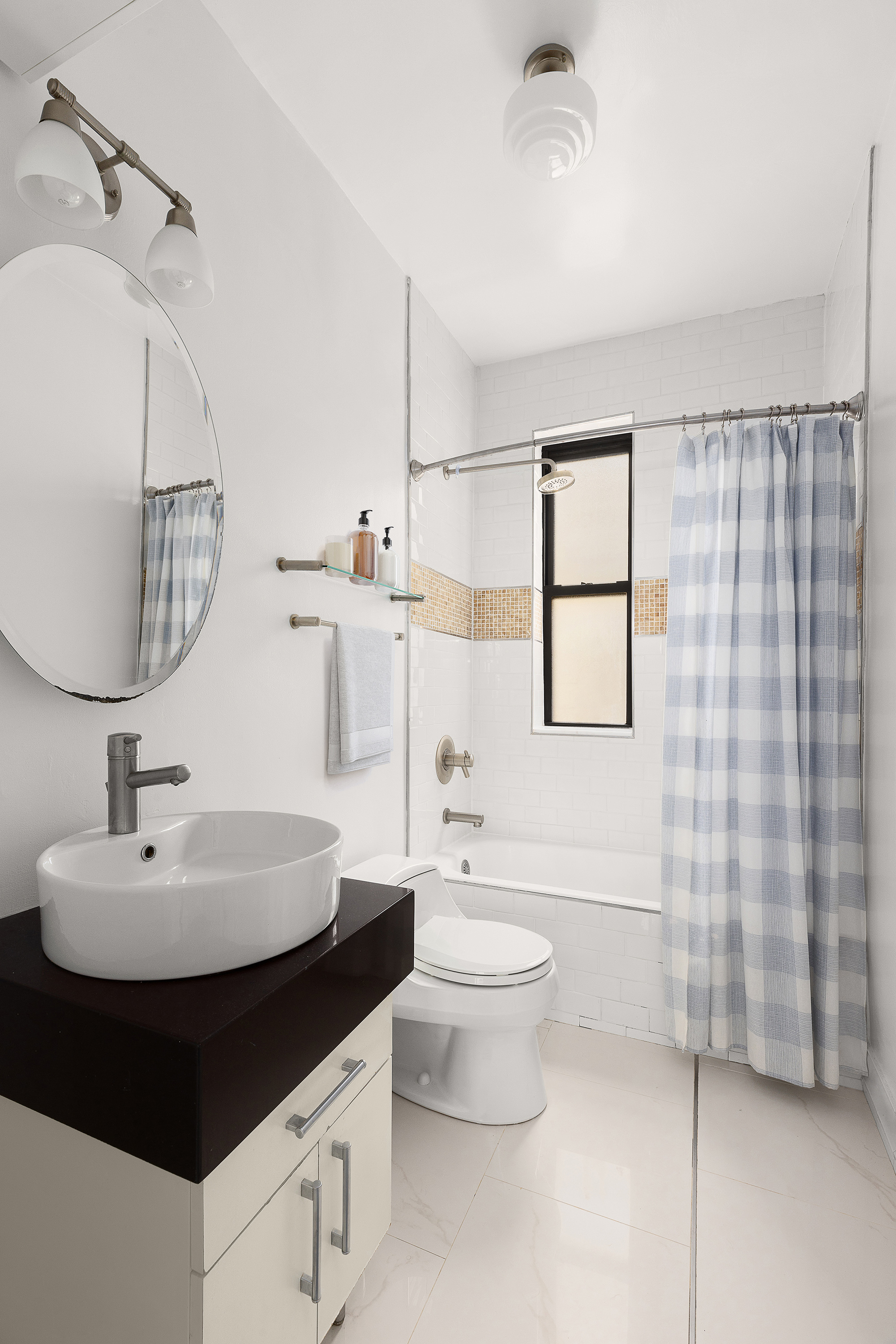 55 West 95th Street, Unit 93 Manhattan, NY 10025 - Photo 7 of 11 a bathroom with a sink toilet and shower