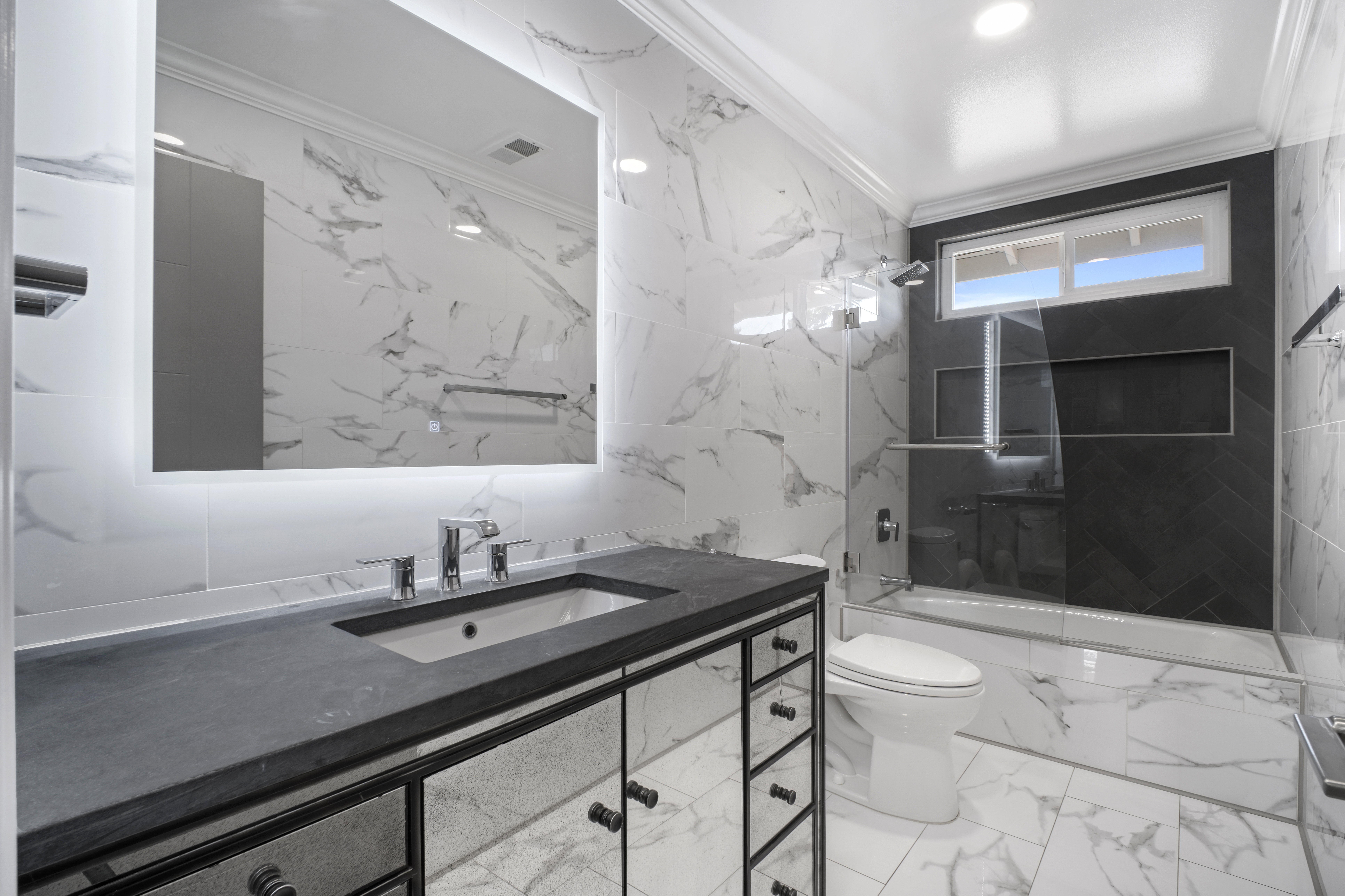 62 Oakdale Avenue San Rafael, CA 94901 - Photo 15 of 32 a bathroom with a sink a toilet a mirror and shower