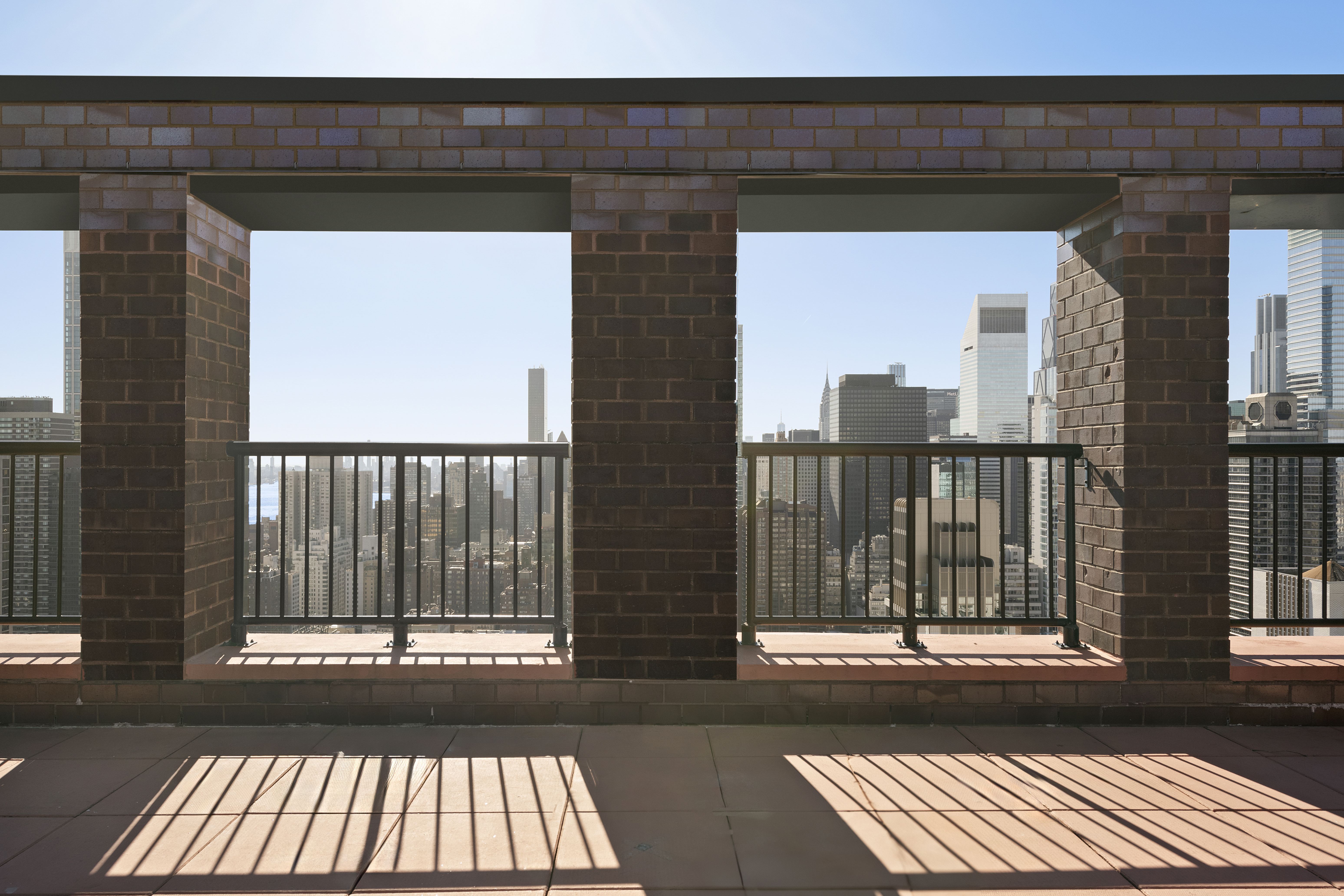 304 East 65th Street, Unit 6D Manhattan, NY 10065 - Photo 8 of 15 a view of a building from a balcony
