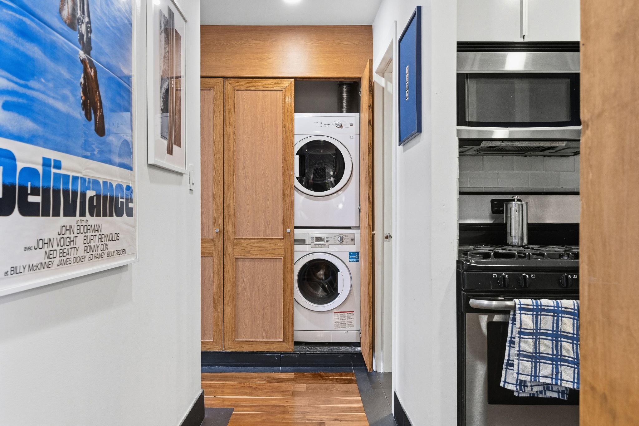 179 Grand Street, Unit 2F Manhattan, NY 10013 - Photo 8 of 11 a utility room with dryer and washer