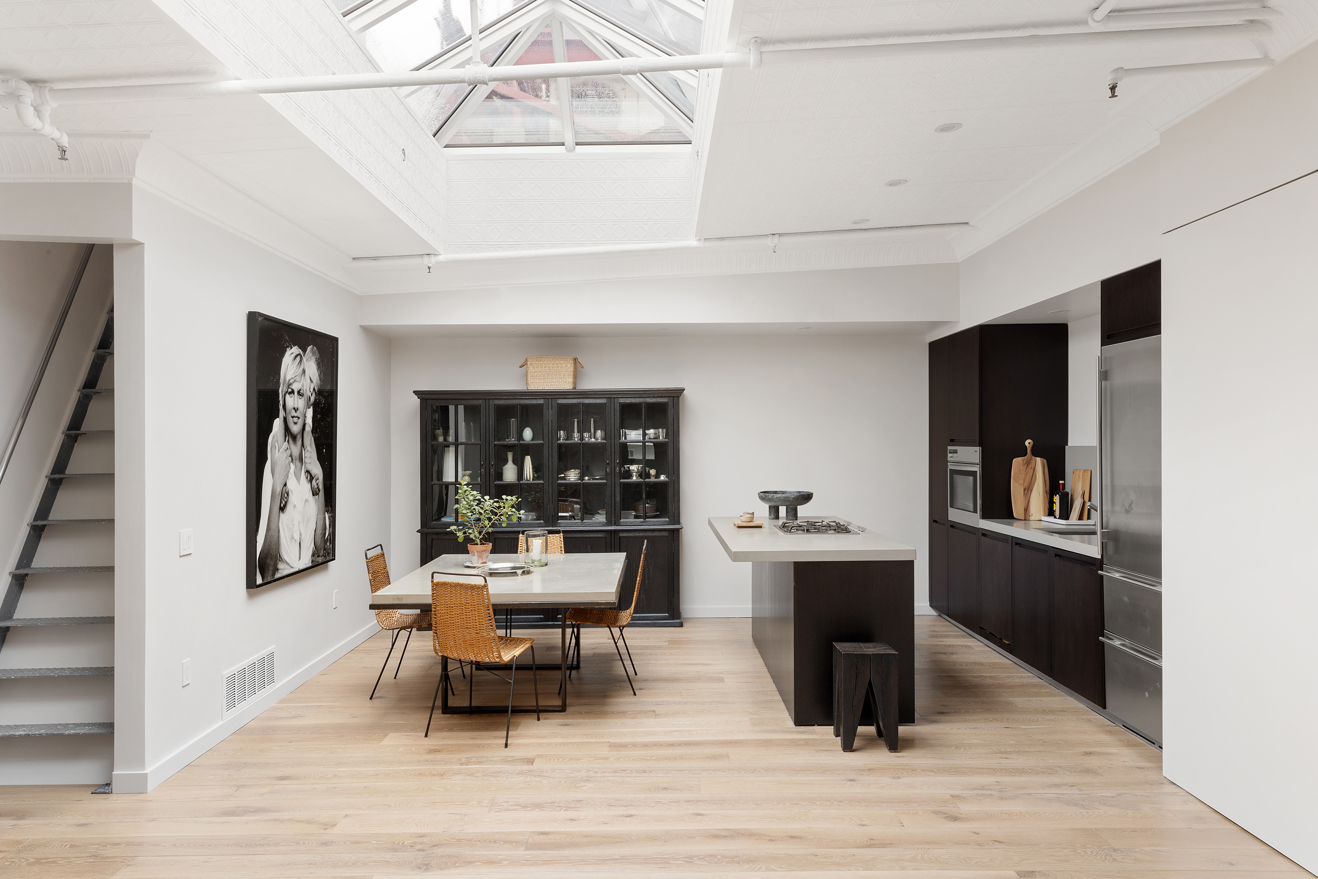 22 East 18th Street, Unit PH6B Manhattan, NY 10003 - Photo 4 of 13 a living room with furniture and wooden floor