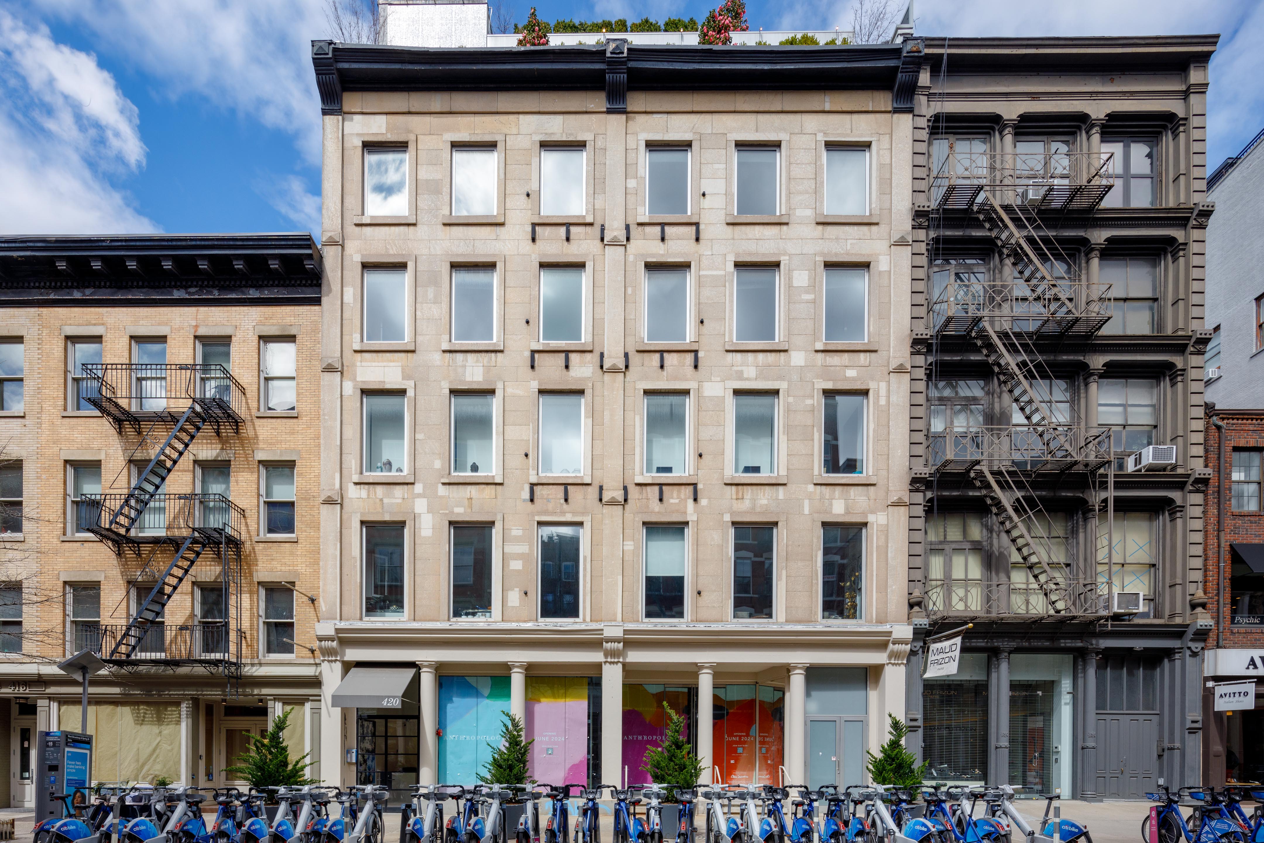 420 West Broadway, Unit 4W Manhattan, NY 10012 - Photo 16 of 17 a view of a building with a lot of windows