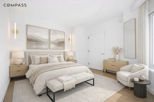 a bedroom with a bed and a couch