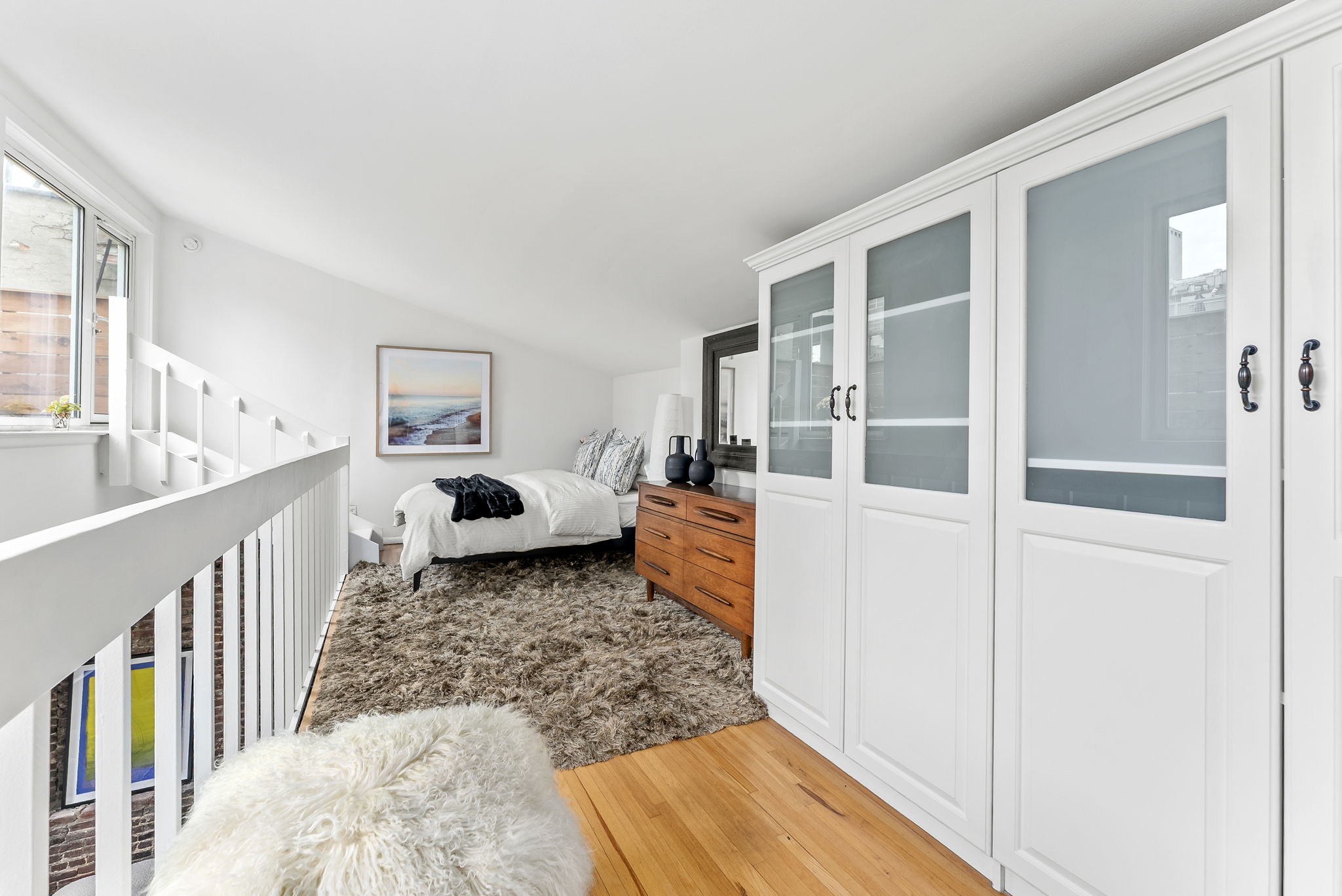 207 East 21st Street, Unit 6E Manhattan, NY 10010 - Photo 8 of 12 a living room with furniture and a rug