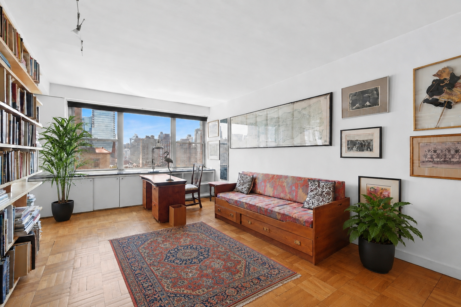 15 West 72nd Street, Unit 25F Manhattan, NY 10023 - Photo 5 of 12 a living room with furniture and a large window