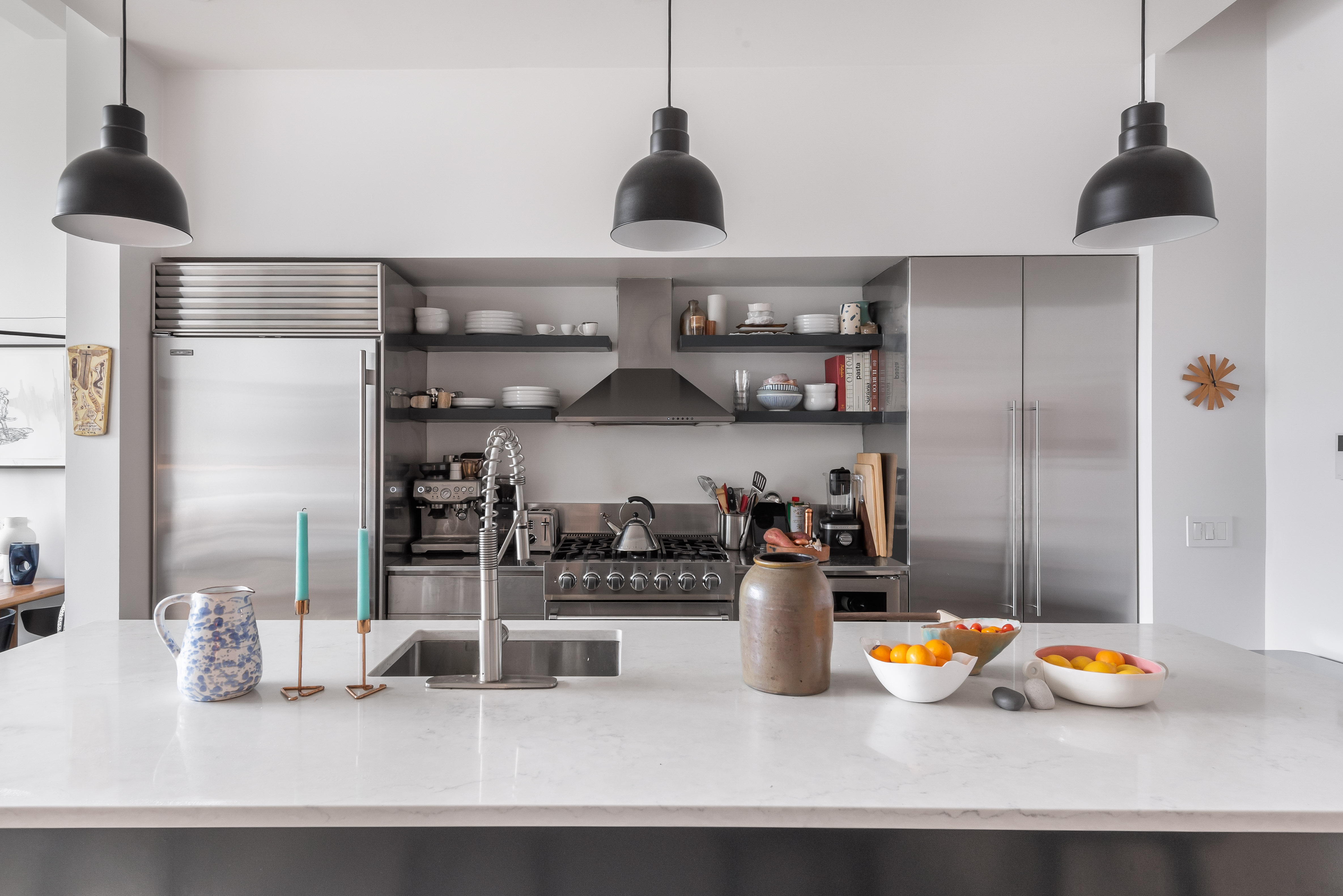 55 Berry Street, Unit 2B Brooklyn, NY 11249 - Photo 3 of 12 a kitchen with stainless steel appliances granite countertop a sink and cabinets