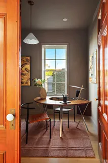 a spacious bathroom with a granite countertop sink and a mirror