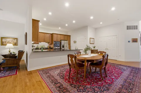 a kitchen with granite countertop sink cabinets and stainless steel appliances