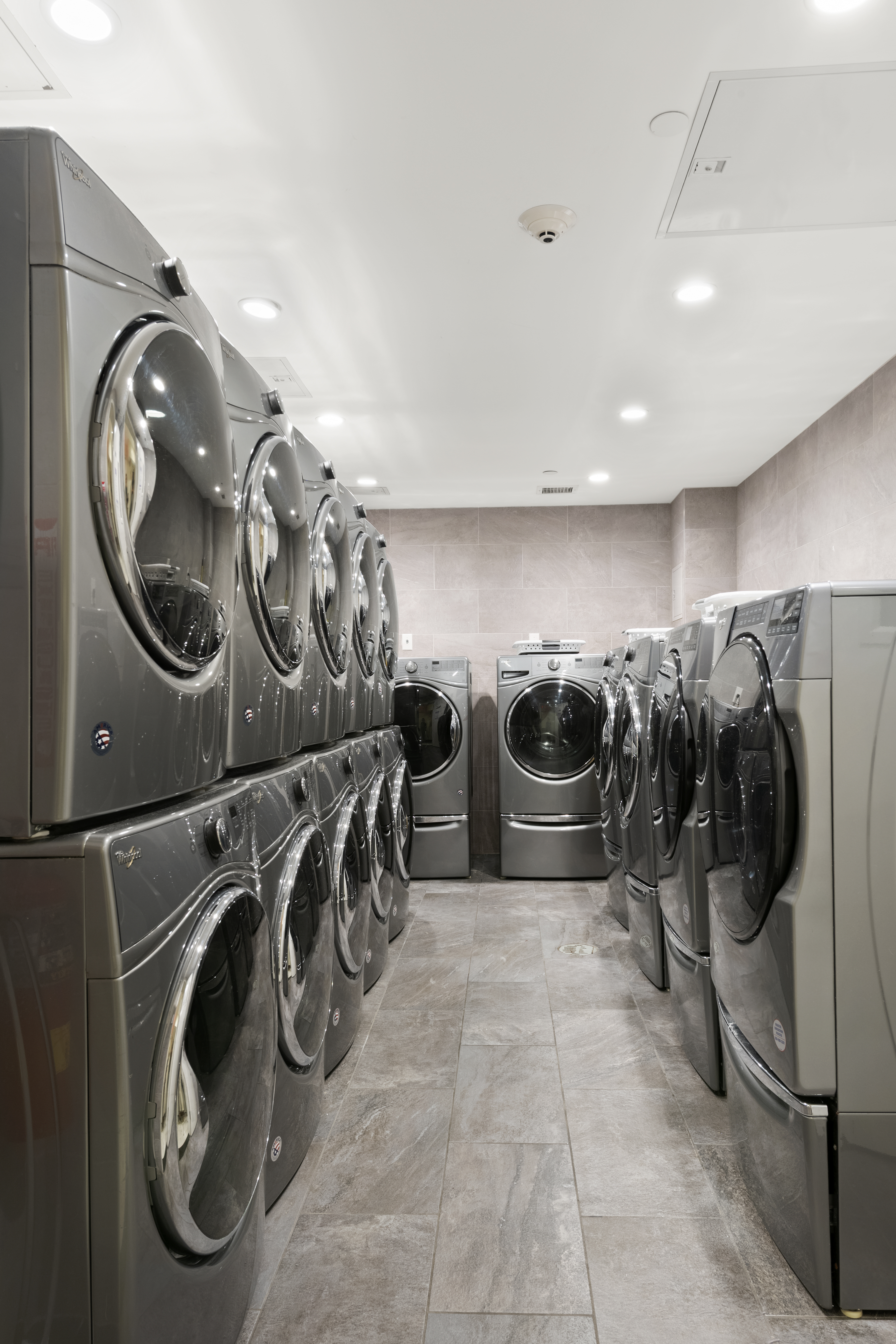 25 Lexington Avenue, Unit 103 Brooklyn, NY 11238 - Photo 8 of 15 a utility room with multiple dryer and washer
