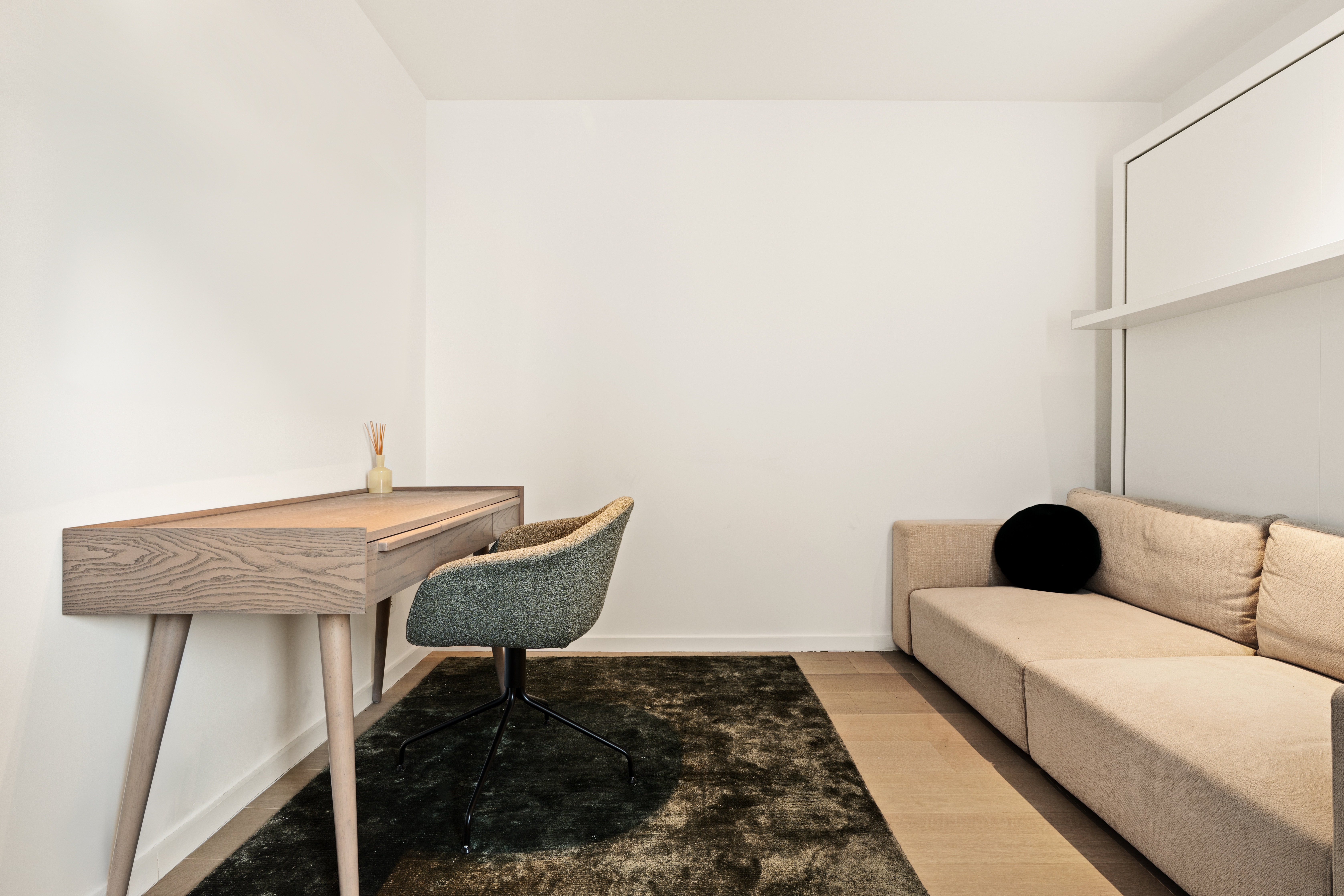 303 East 57th Street, Unit 44G Manhattan, NY 10022 - Photo 16 of 19 a living room with a couch