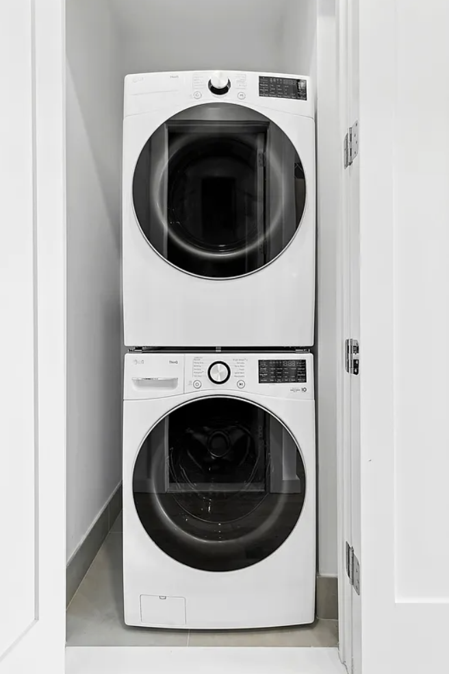 138 Schaefer Street, Unit 3 Brooklyn, NY 11207 - Photo 8 of 11 a utility room with dryer and washer