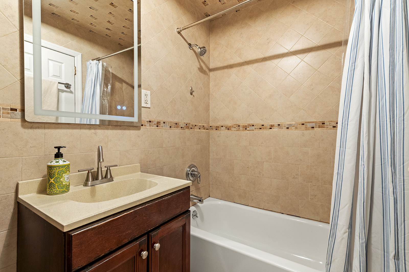 570 19th Street Brooklyn, NY 11218 - Photo 8 of 13 a bathroom with a sink and a bathtub