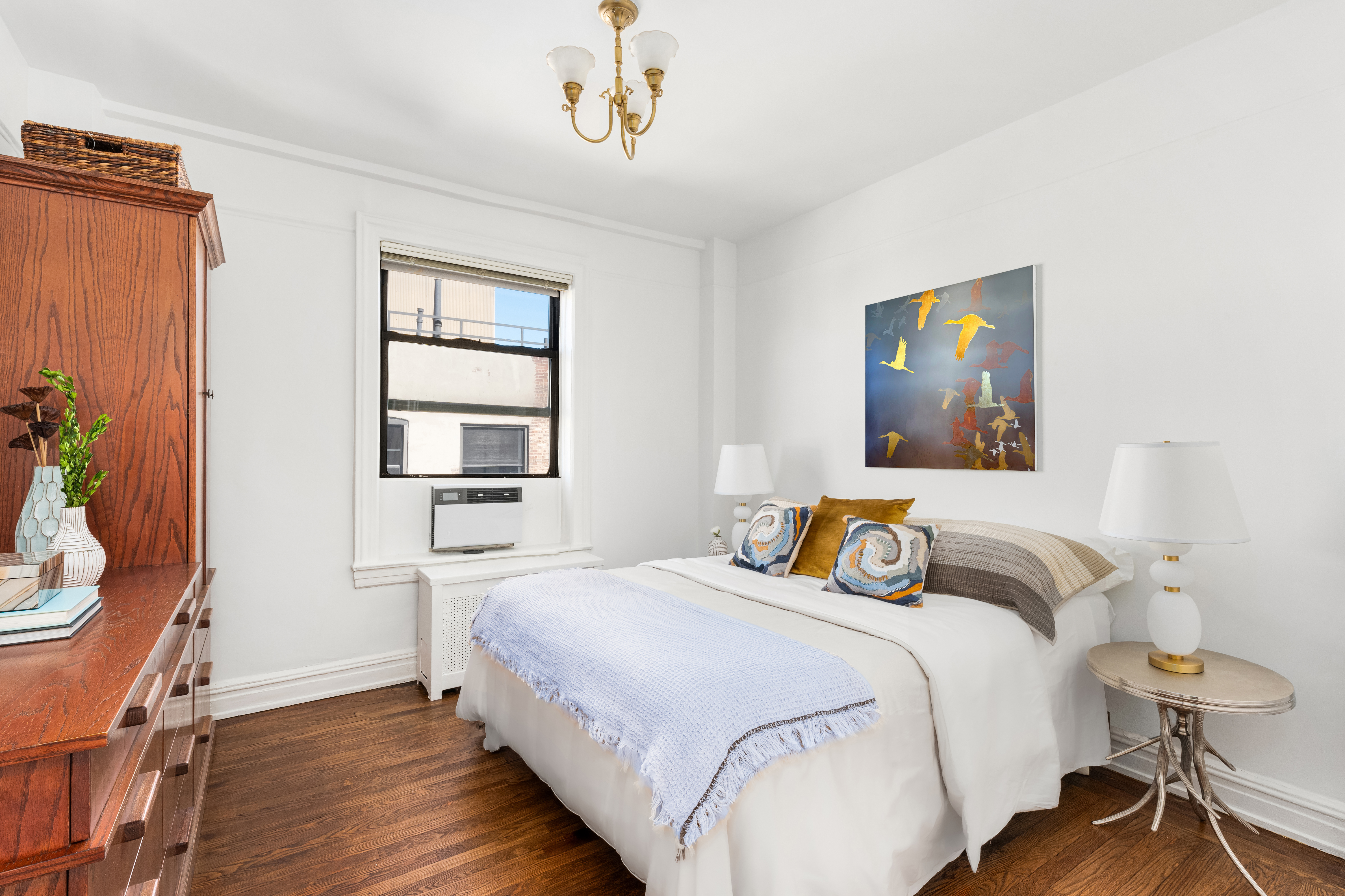 41 West 82nd Street, Unit 9D Manhattan, NY 10024 - Photo 9 of 15 a bedroom with a bed and wooden floor
