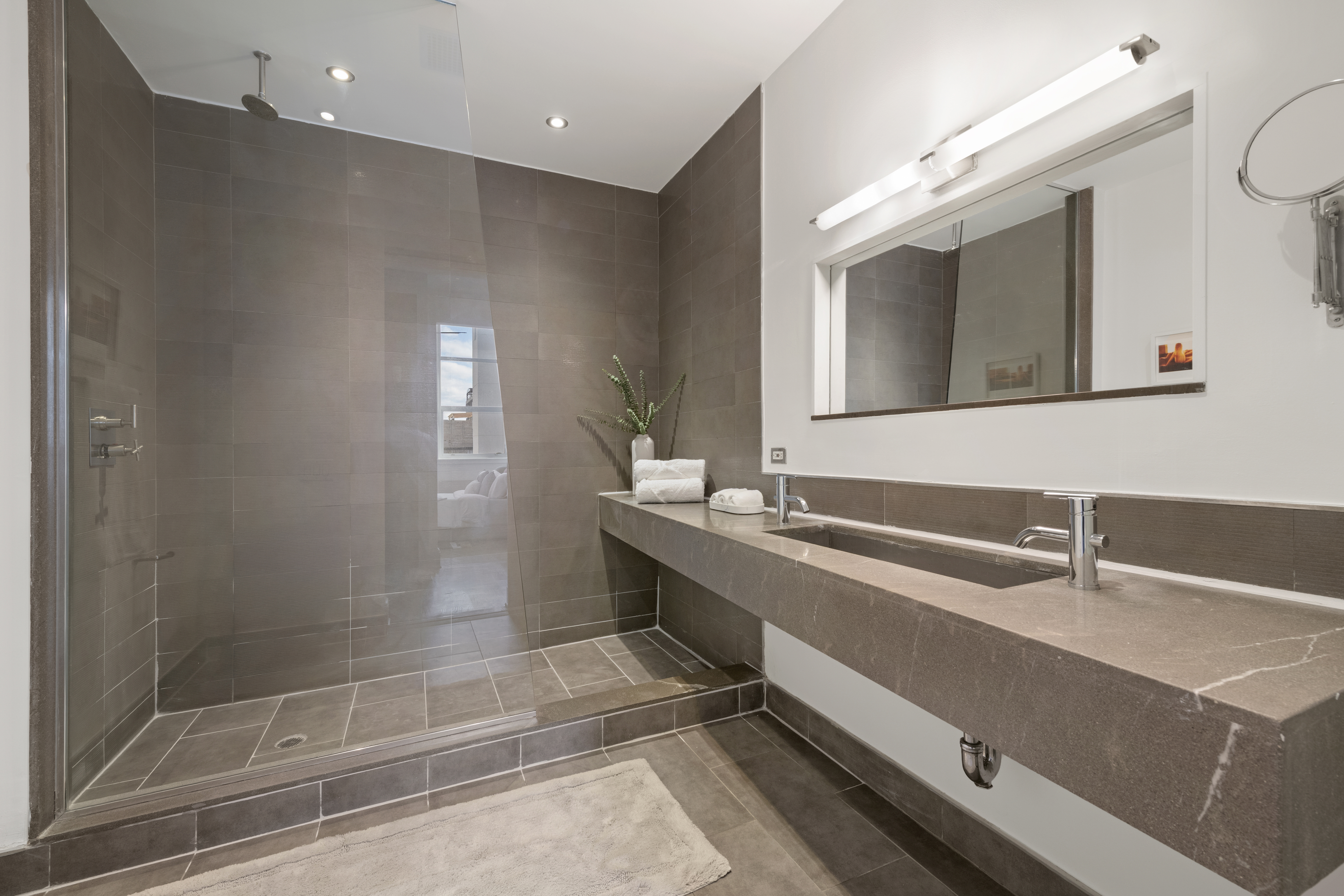 55 Berry Street, Unit 4B Brooklyn, NY 11249 - Photo 5 of 12 a bathroom with a sink and a mirror