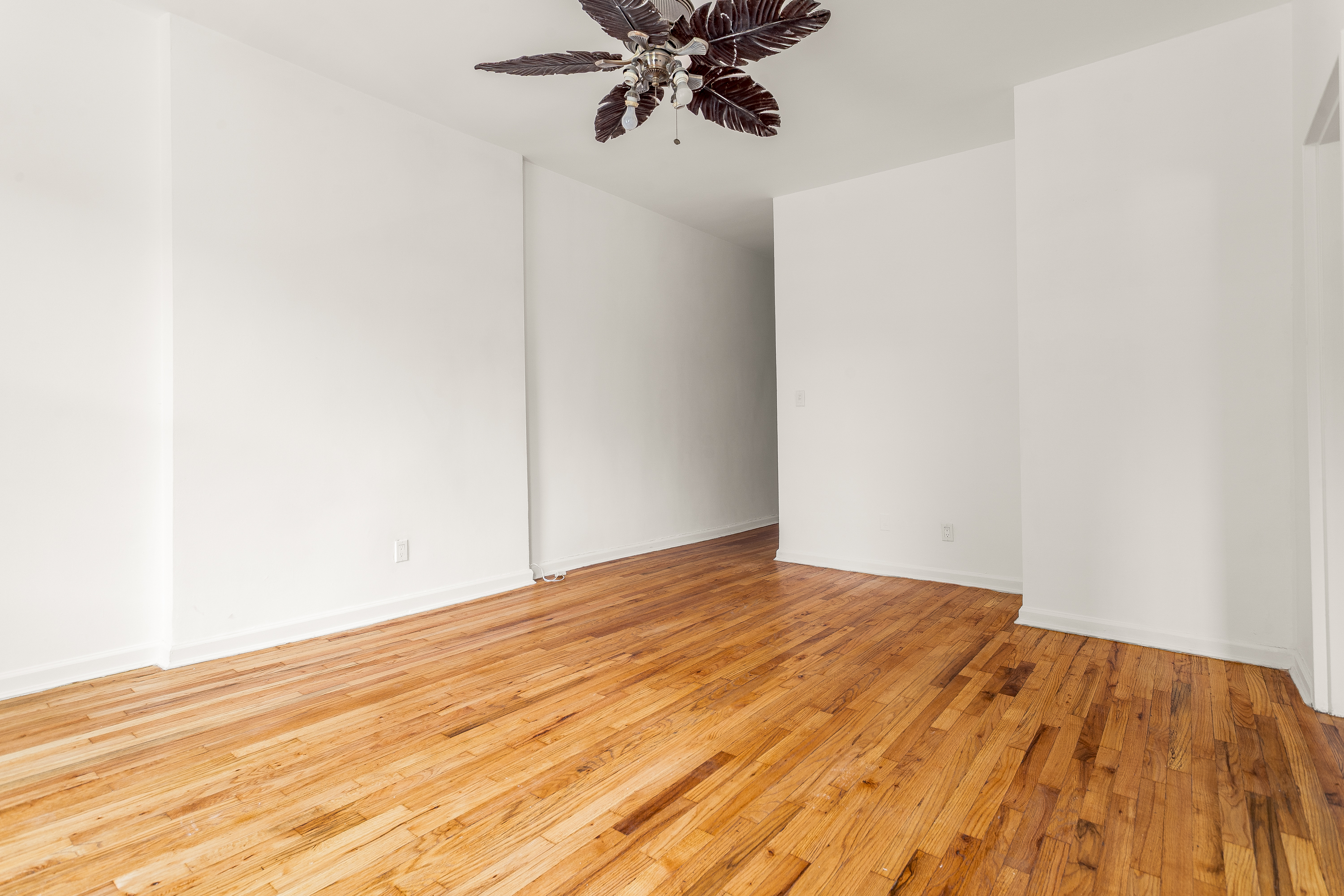 157 West 123rd Street, Unit 2A Manhattan, NY 10027 - Photo 5 of 16 a view of empty room with wooden floor