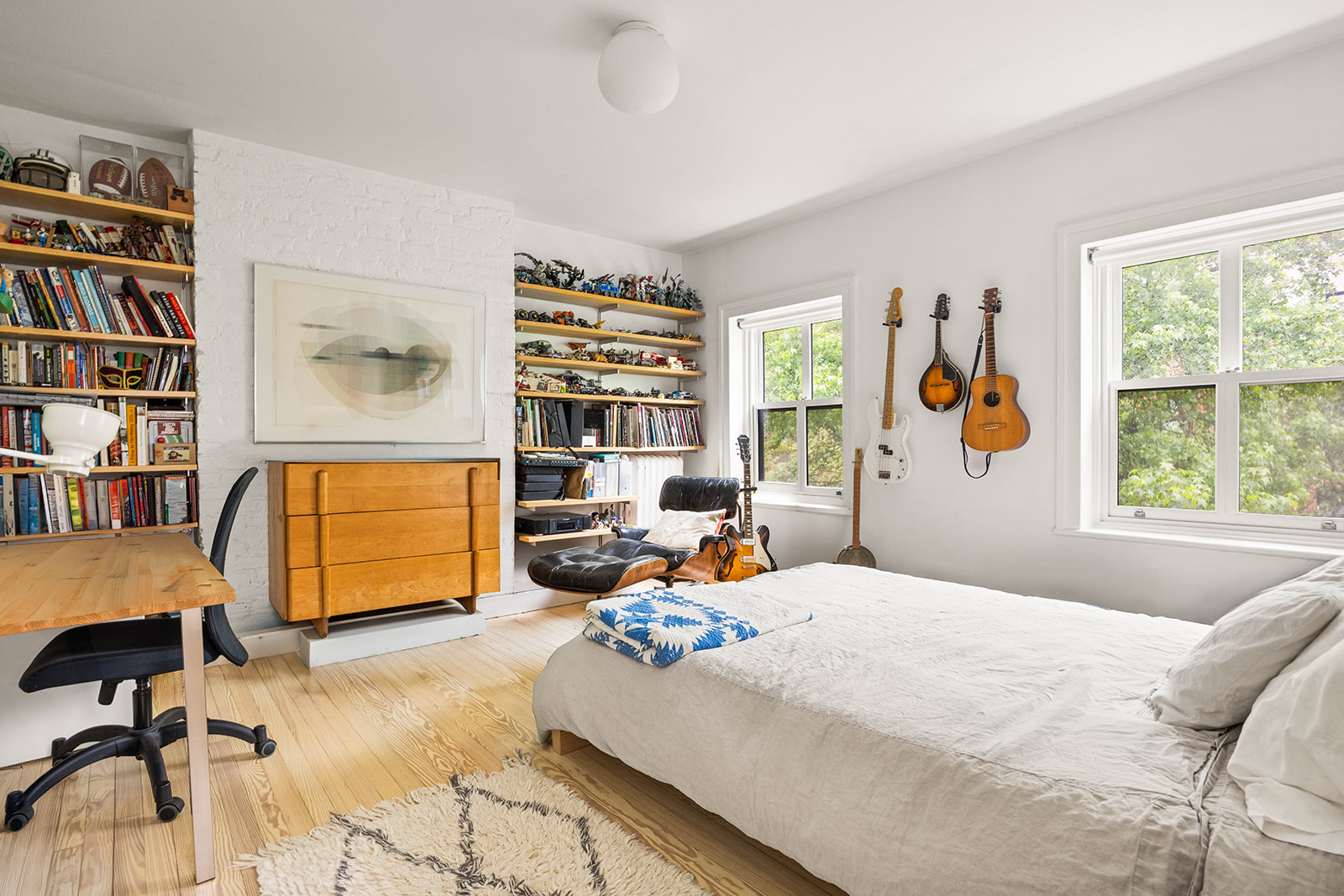 298 State Street, Unit TRIPLEX Brooklyn, NY 11201 - Photo 11 of 21 a bedroom with a bed a standing window and a book shelf