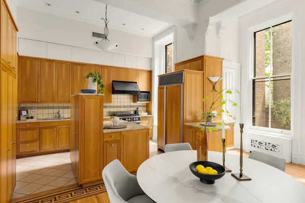 a kitchen with refrigerator and stove