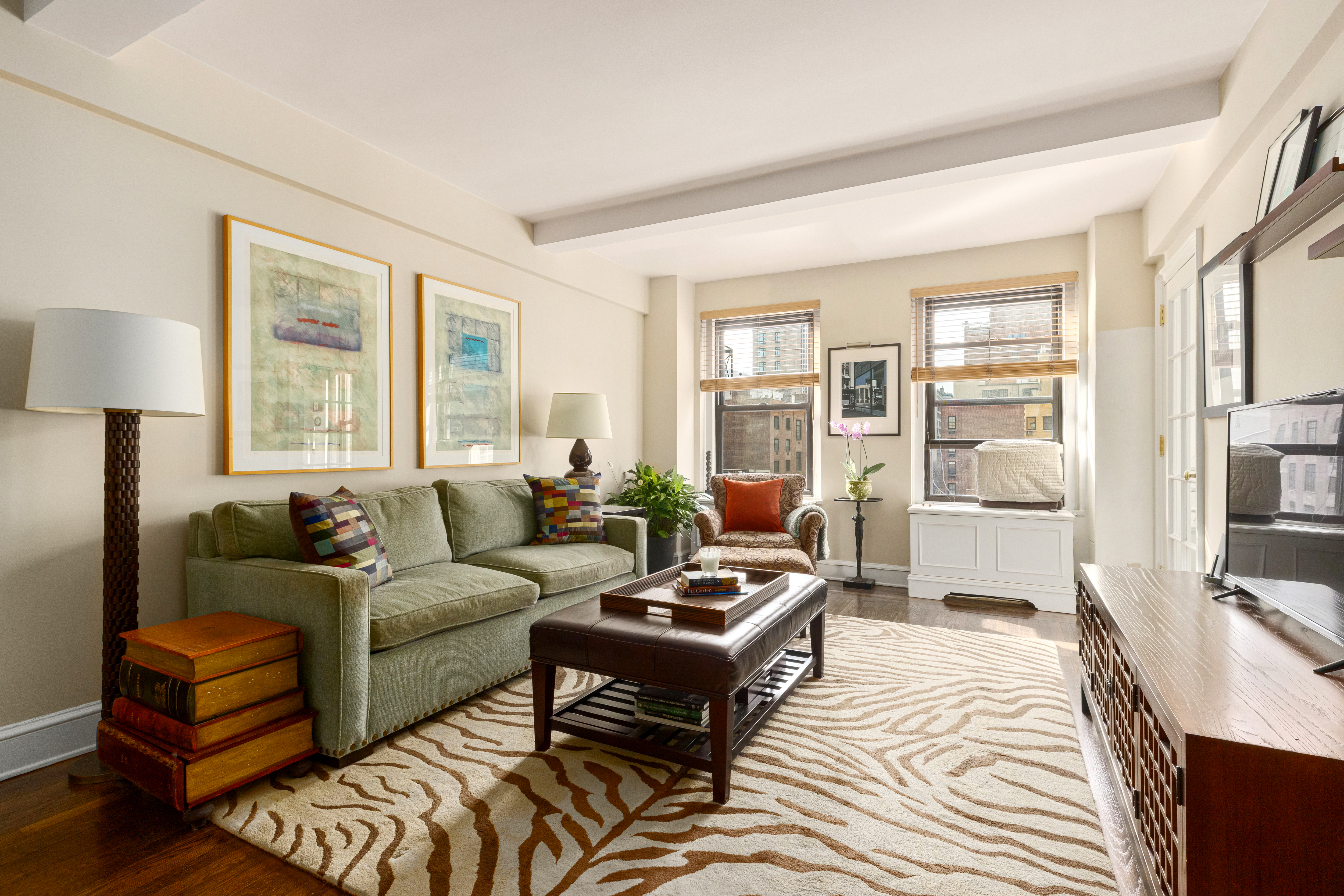 205 East 78th Street, Unit 9F Manhattan, NY 10075 - Photo 3 of 11 a living room with furniture and a window