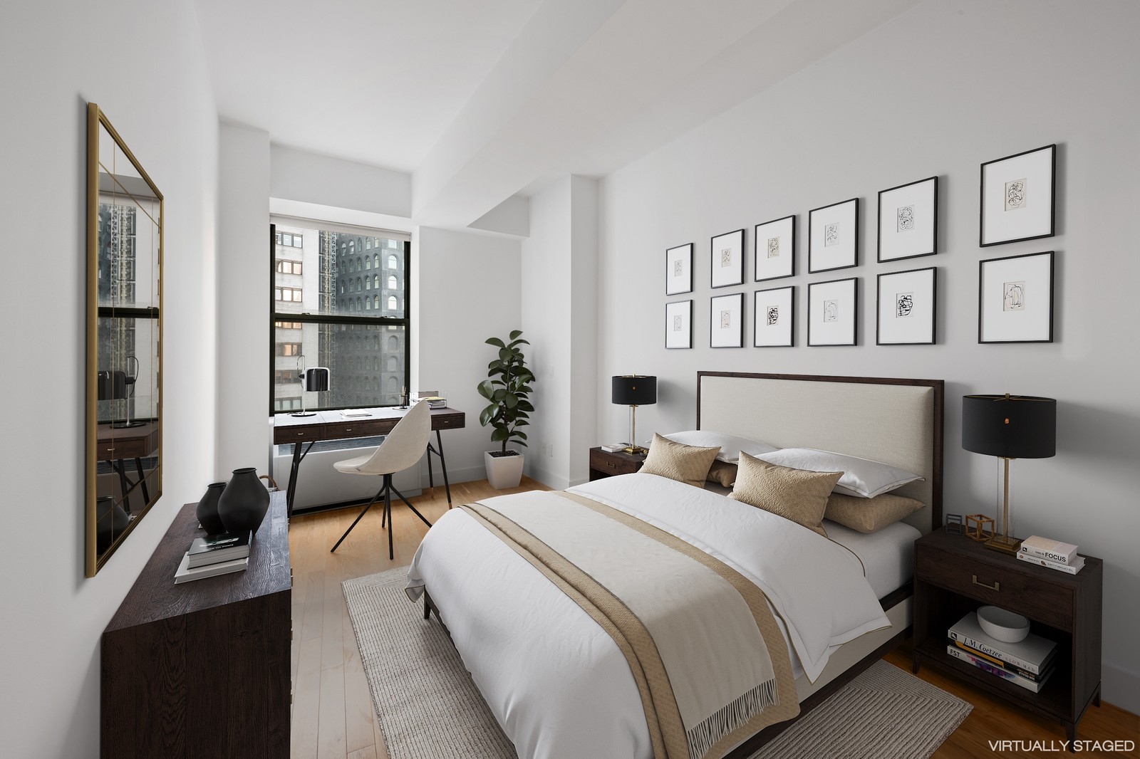 99 John Street, Unit 1711 Manhattan, NY 10038 - Photo 1 of 14 a bedroom with a bed and a table in it