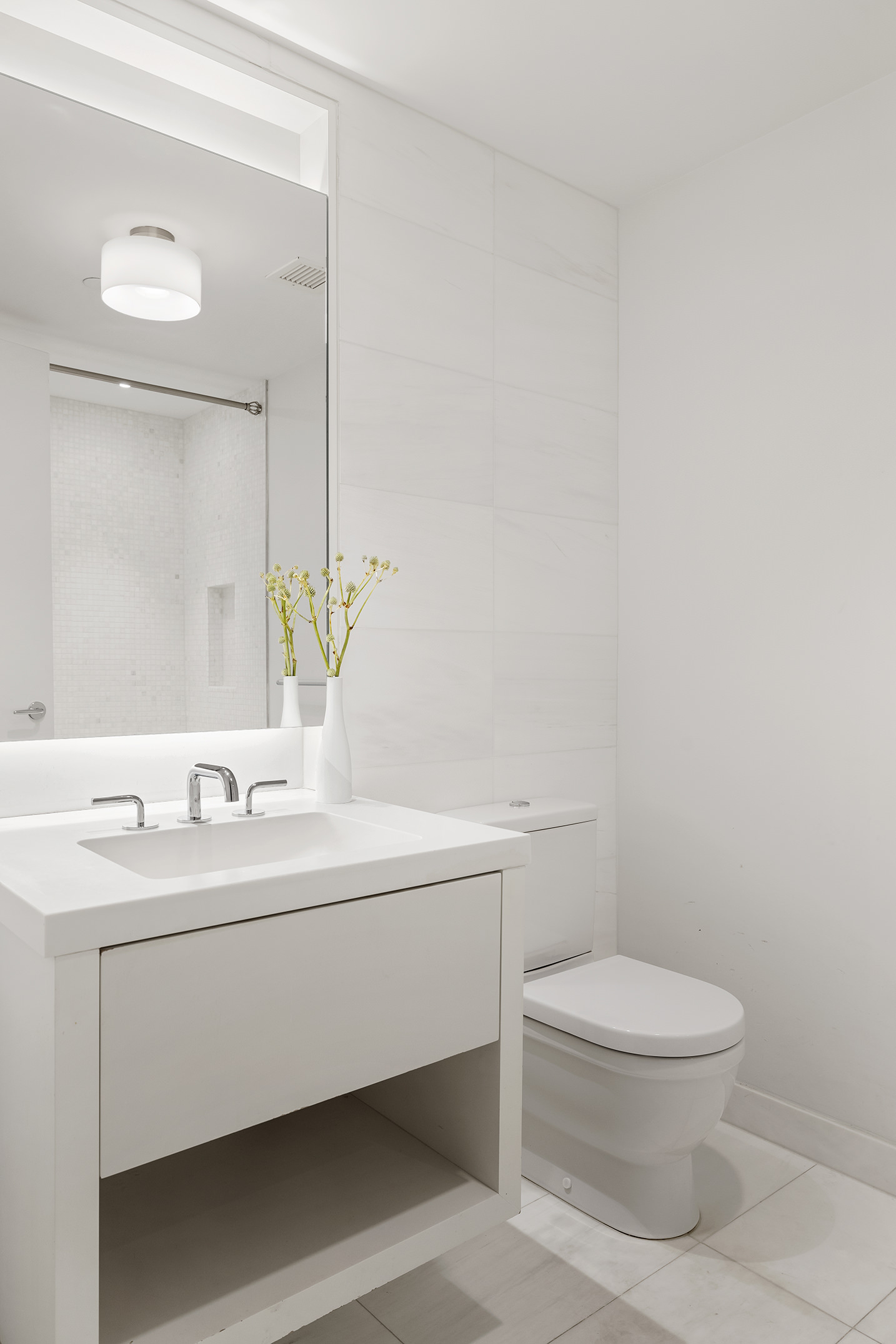 221 West 77th Street, Unit 4E Manhattan, NY 10024 - Photo 14 of 20 a bathroom with a toilet a sink and mirror