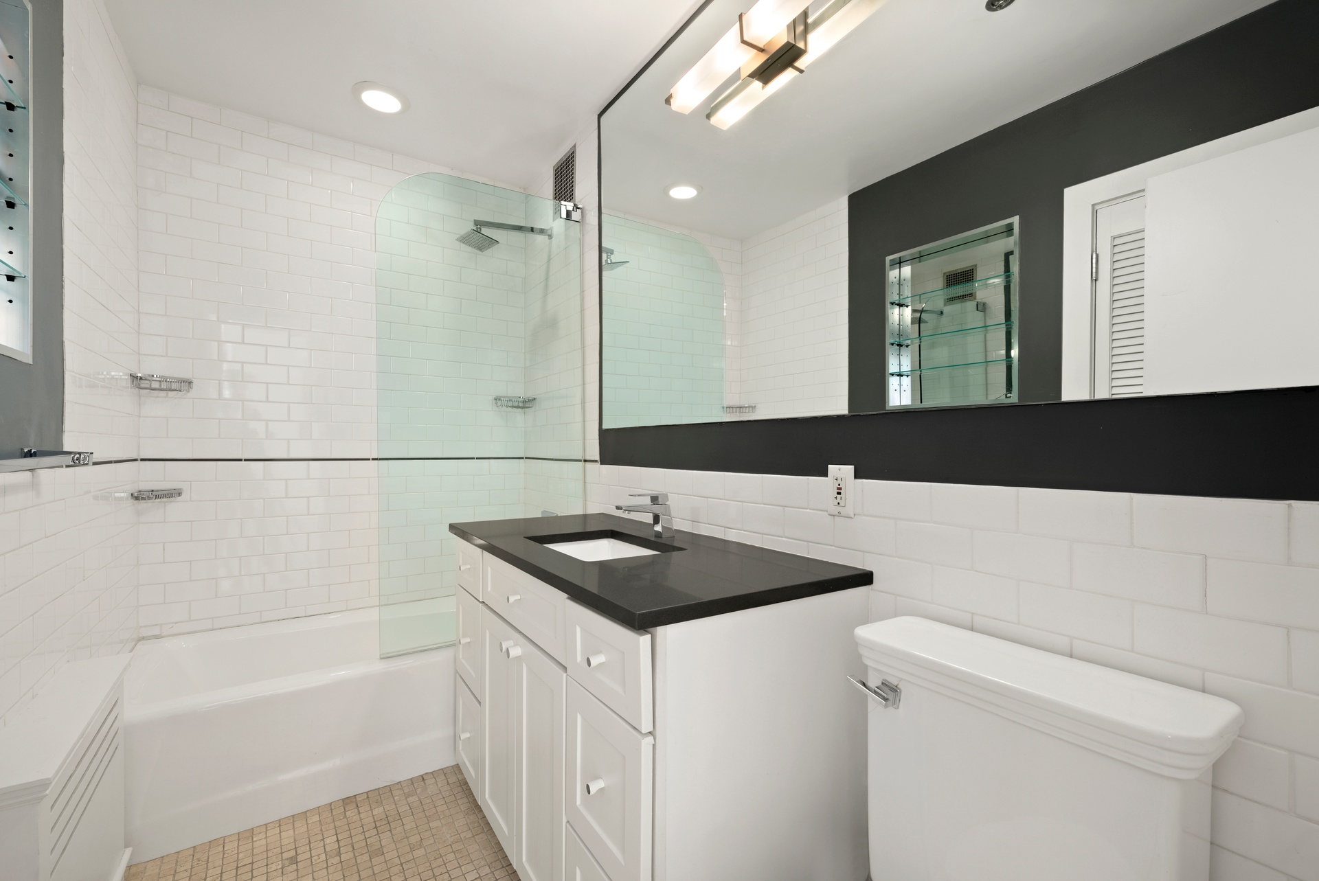 520 LaGuardia Place, Unit 2N Manhattan, NY 10012 - Photo 17 of 20 a bathroom with a sink a toilet and a bathtub
