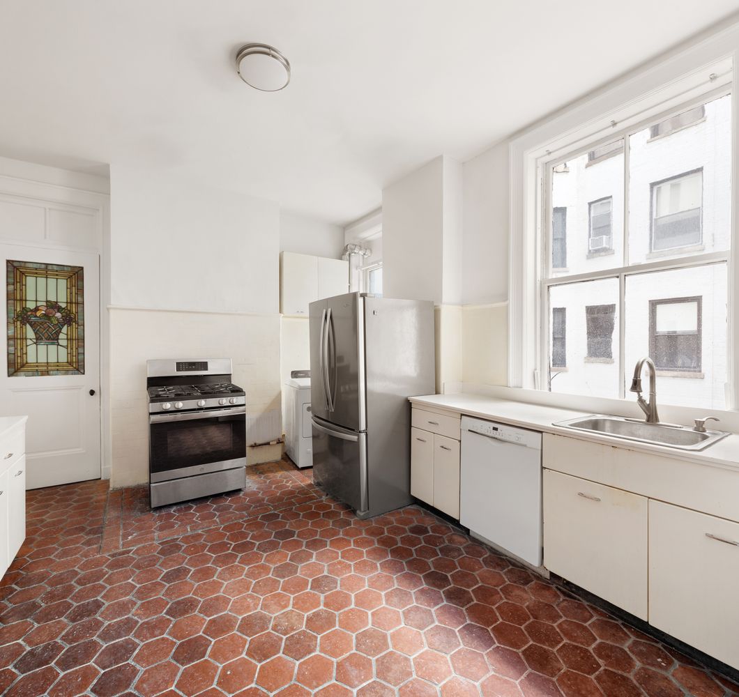 50 Central Park West, Unit 8BB Manhattan, NY 10023 - Photo 15 of 28 a kitchen with stainless steel appliances granite countertop a stove a sink and a refrigerator
