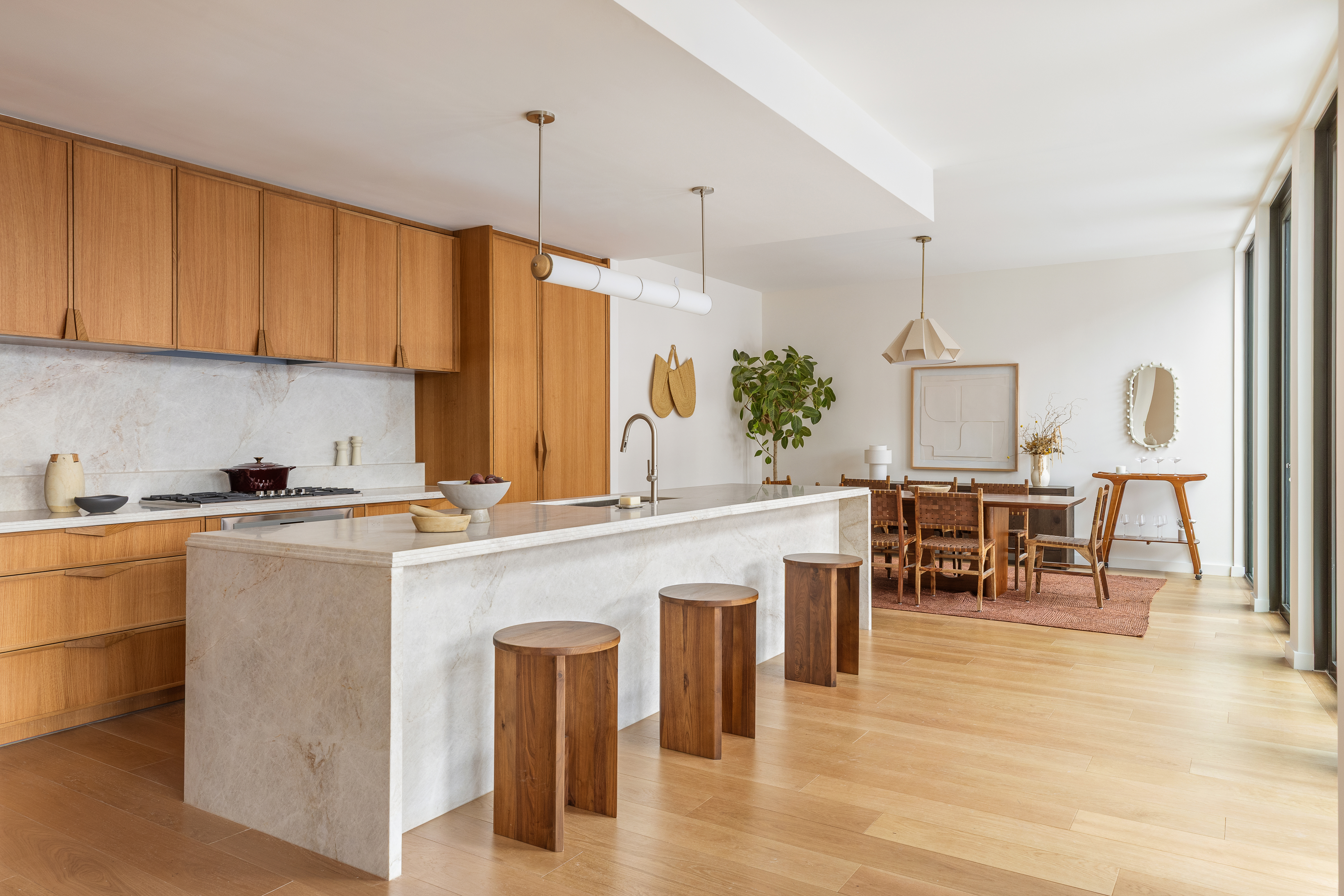 323 Bergen Street, Unit PH608E Brooklyn, NY 11217 - Photo 2 of 37 a kitchen with a table chairs sink and cabinets