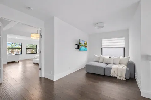 a bedroom with furniture and a window