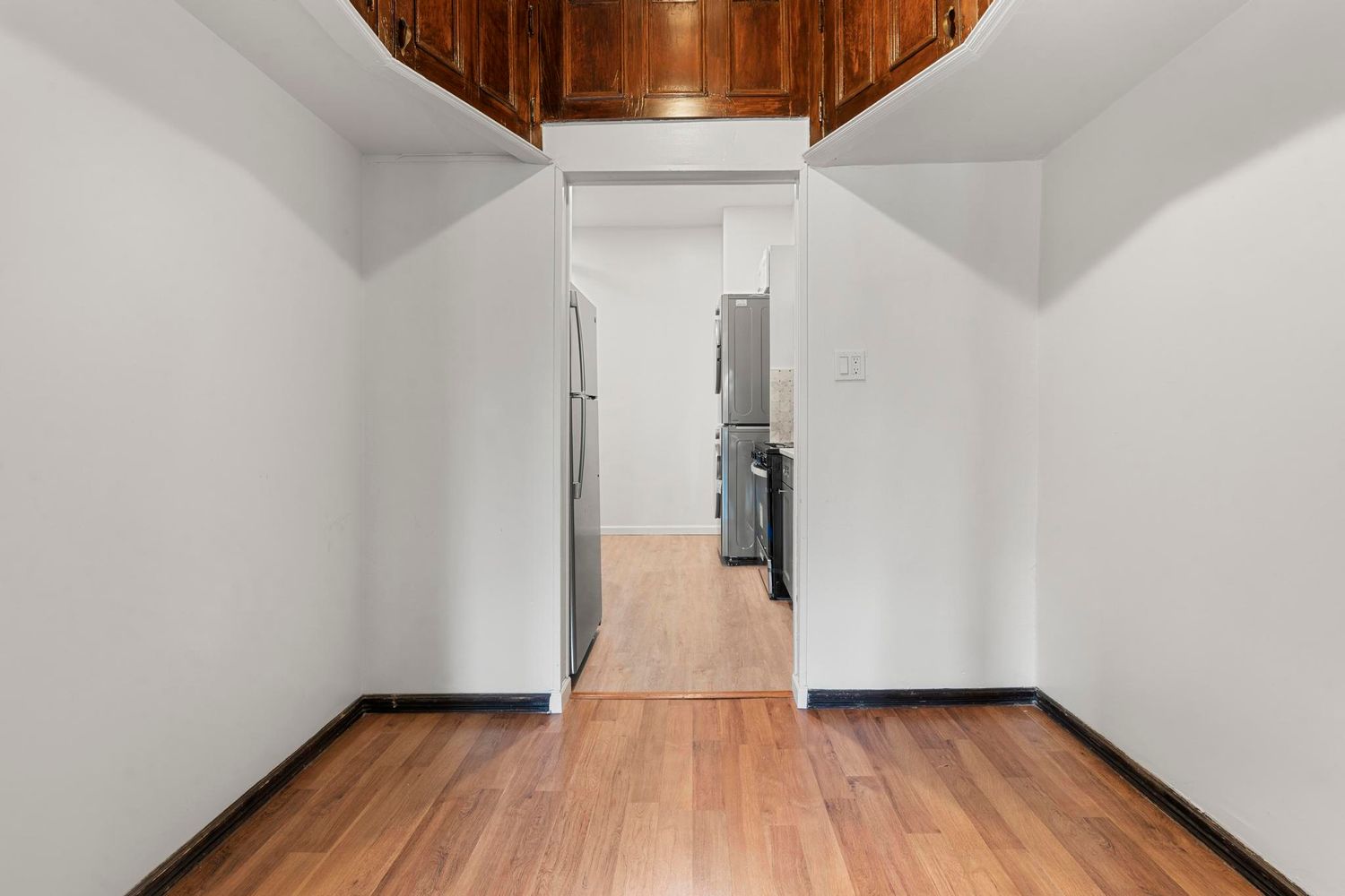 880 Park Place, Unit 2 Brooklyn, NY 11216 - Photo 7 of 12 a view of a hallway with wooden floor and entryway