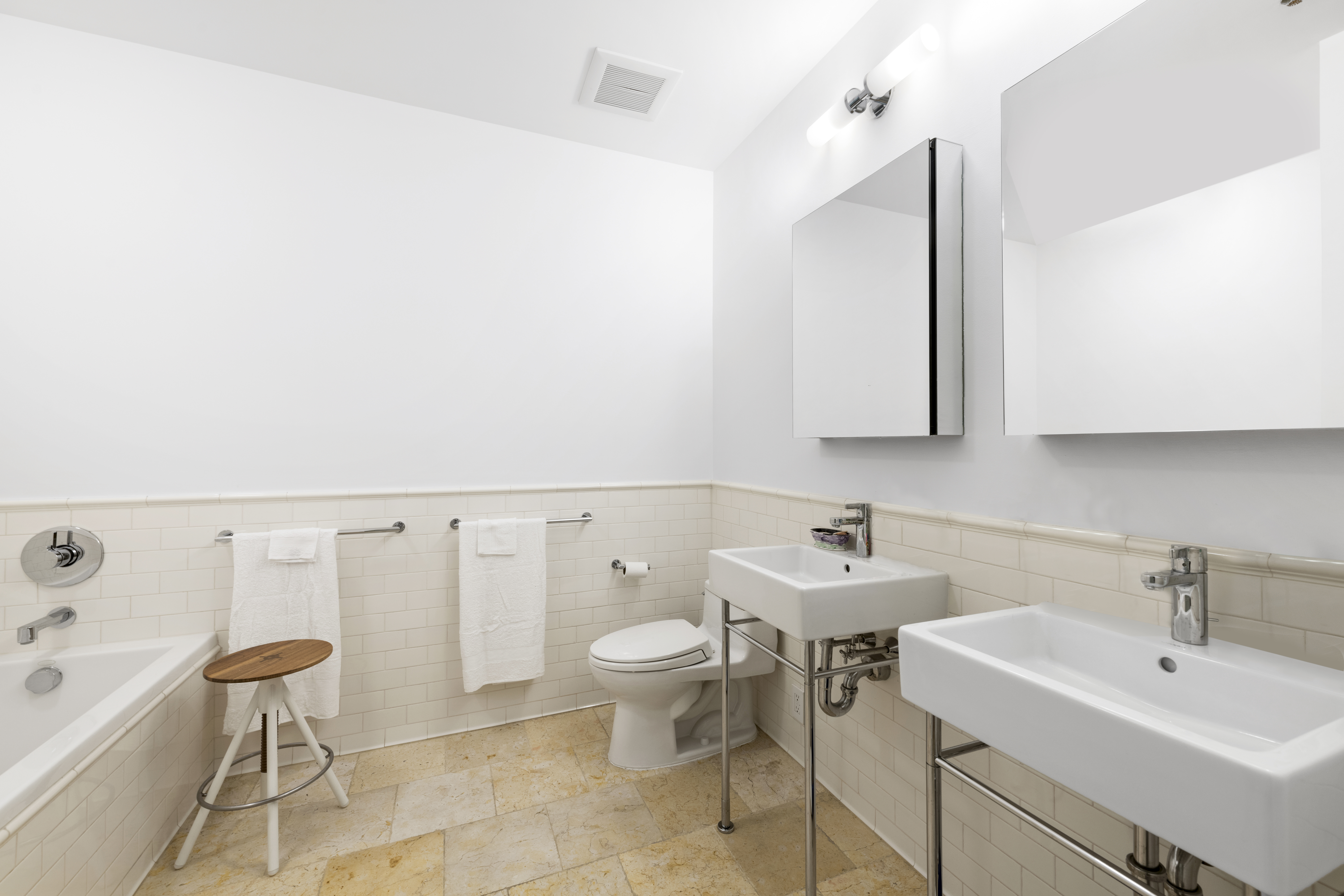 60 Collister Street, Unit 1B Manhattan, NY 10013 - Photo 8 of 20 a bathroom with a sink toilet and a mirror