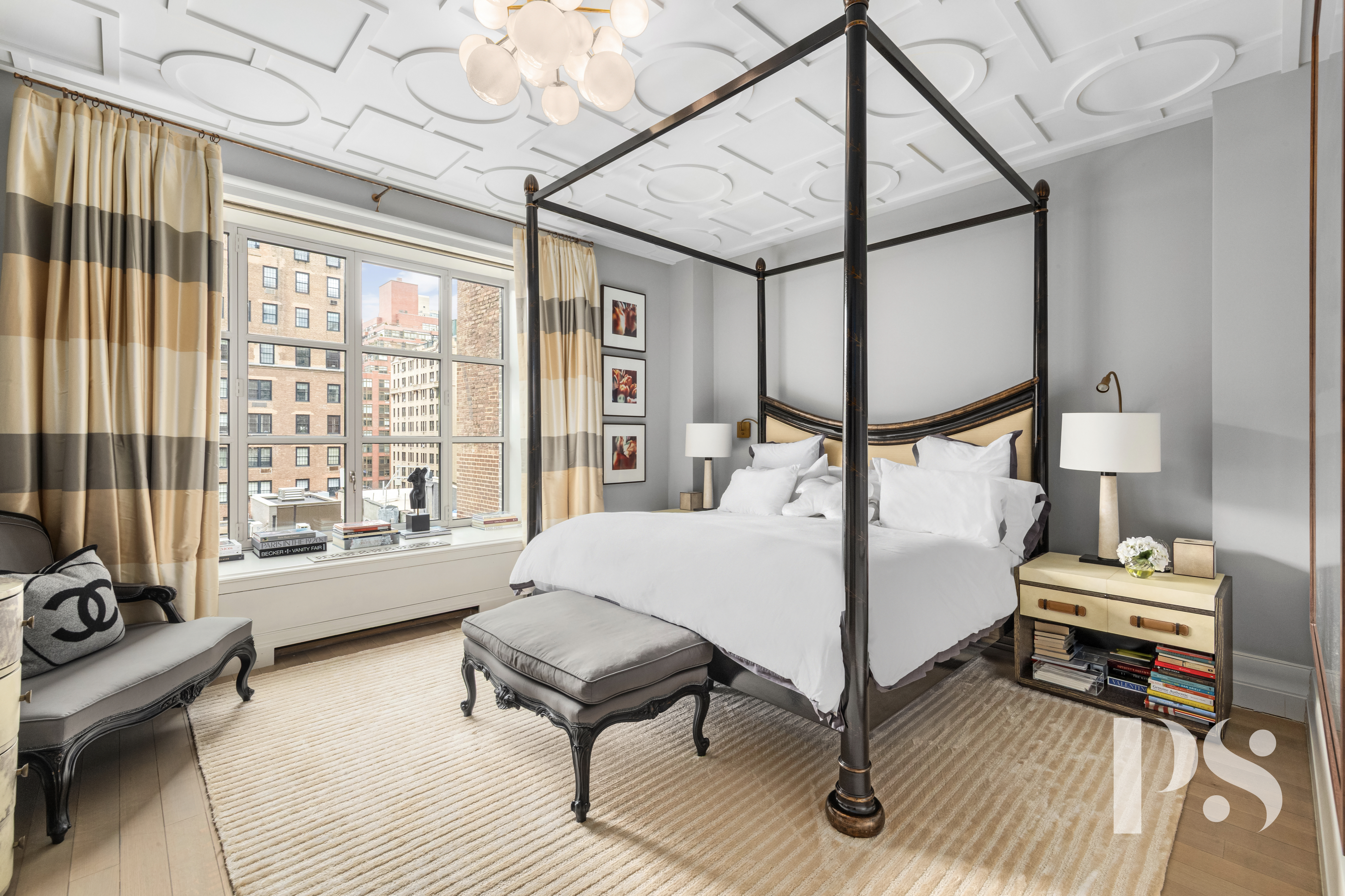 135 East 79th Street, Unit 8E Manhattan, NY 10075 - Photo 15 of 26 a living room with furniture and a floor to ceiling window