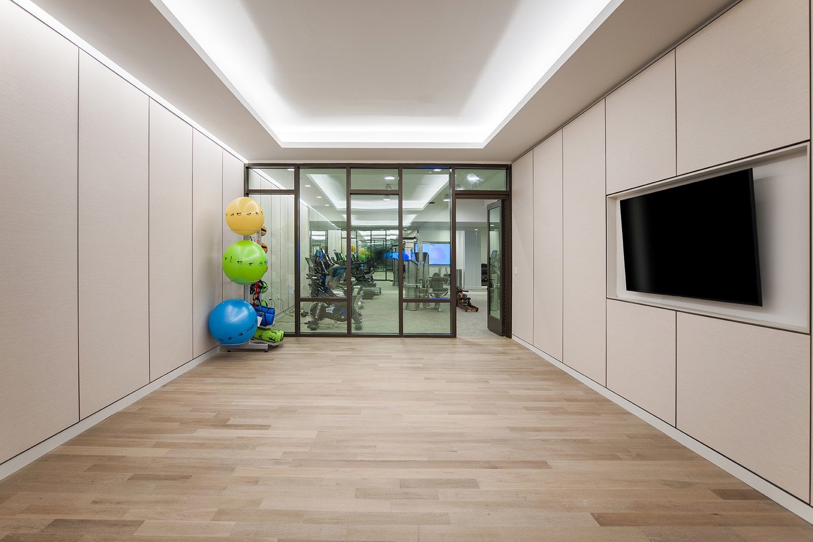 146 Pierrepont Street, Unit 2C Brooklyn, NY 11201 - Photo 24 of 30 a view of an empty room with a flat screen tv and glass door