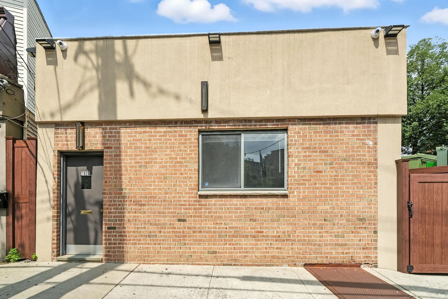 a view of a building with a door and a window