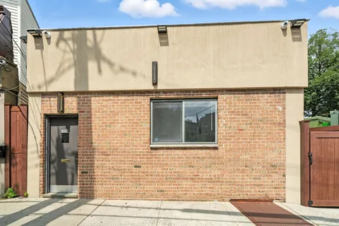 a view of a building with a door and a window