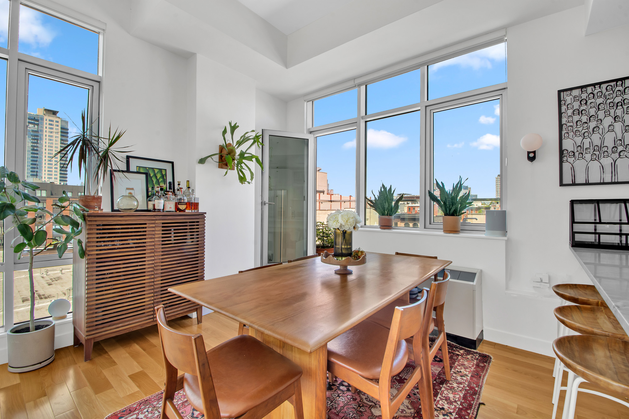 101 North 5th Street, Unit 5A Brooklyn, NY 11249 - Photo 6 of 26 a view of a dining room with furniture and a potted plant