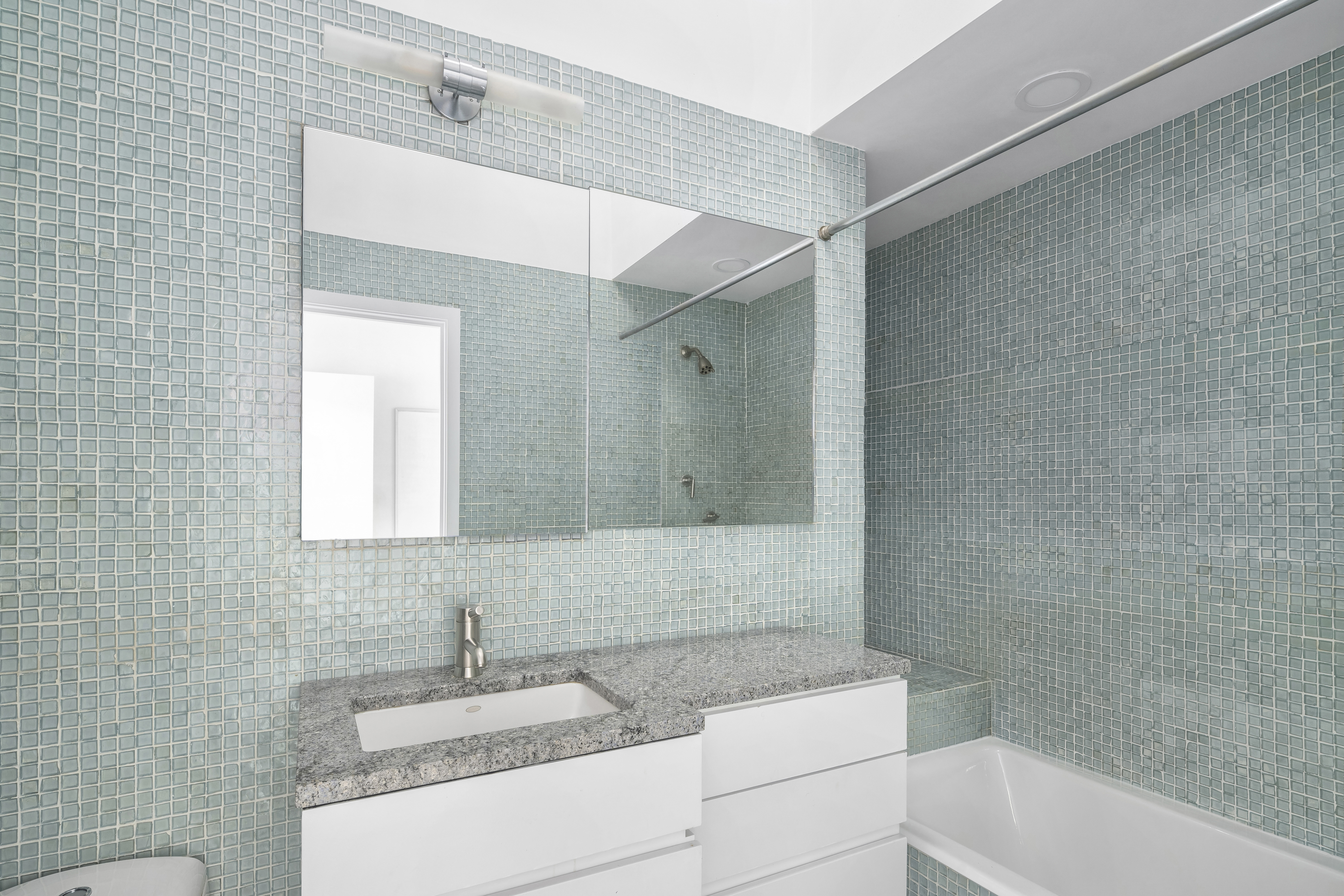 2166 Broadway, Unit PH Manhattan, NY 10024 - Photo 18 of 37 a bathroom with a sink and a mirror