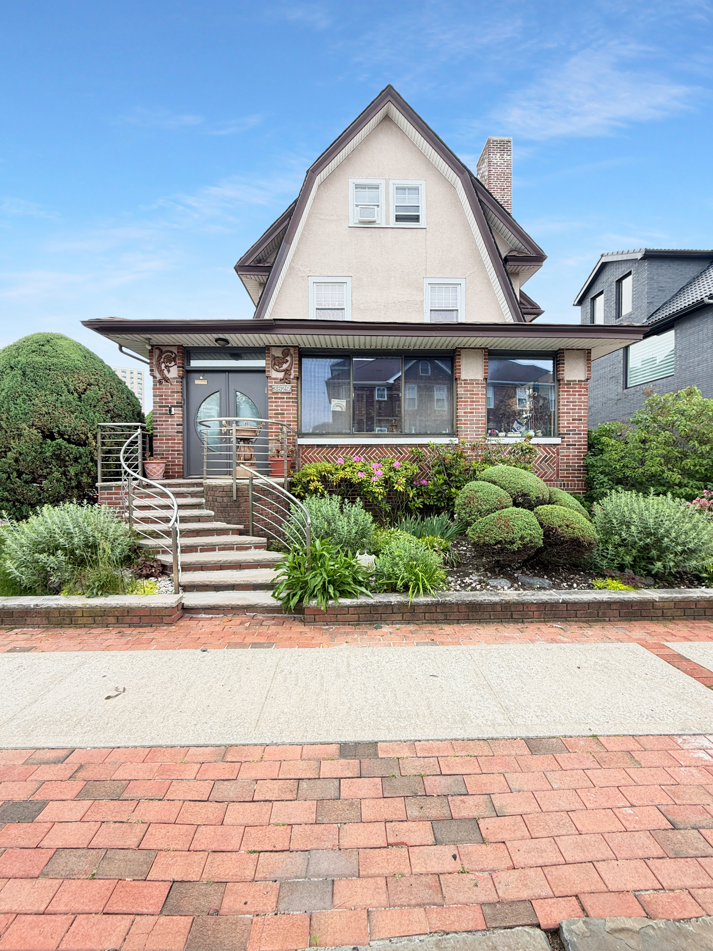 3829 Beach 38th Street Brooklyn, NY 11224 - Photo 5 of 31 a front view of a house with a yard